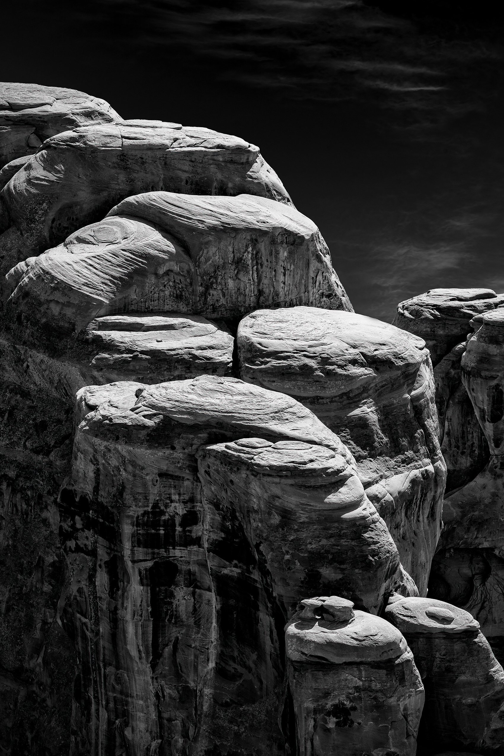 Highlighted in the afternoon sun, pillars of stone align into steps to the sky in Arches National Park, Utah.