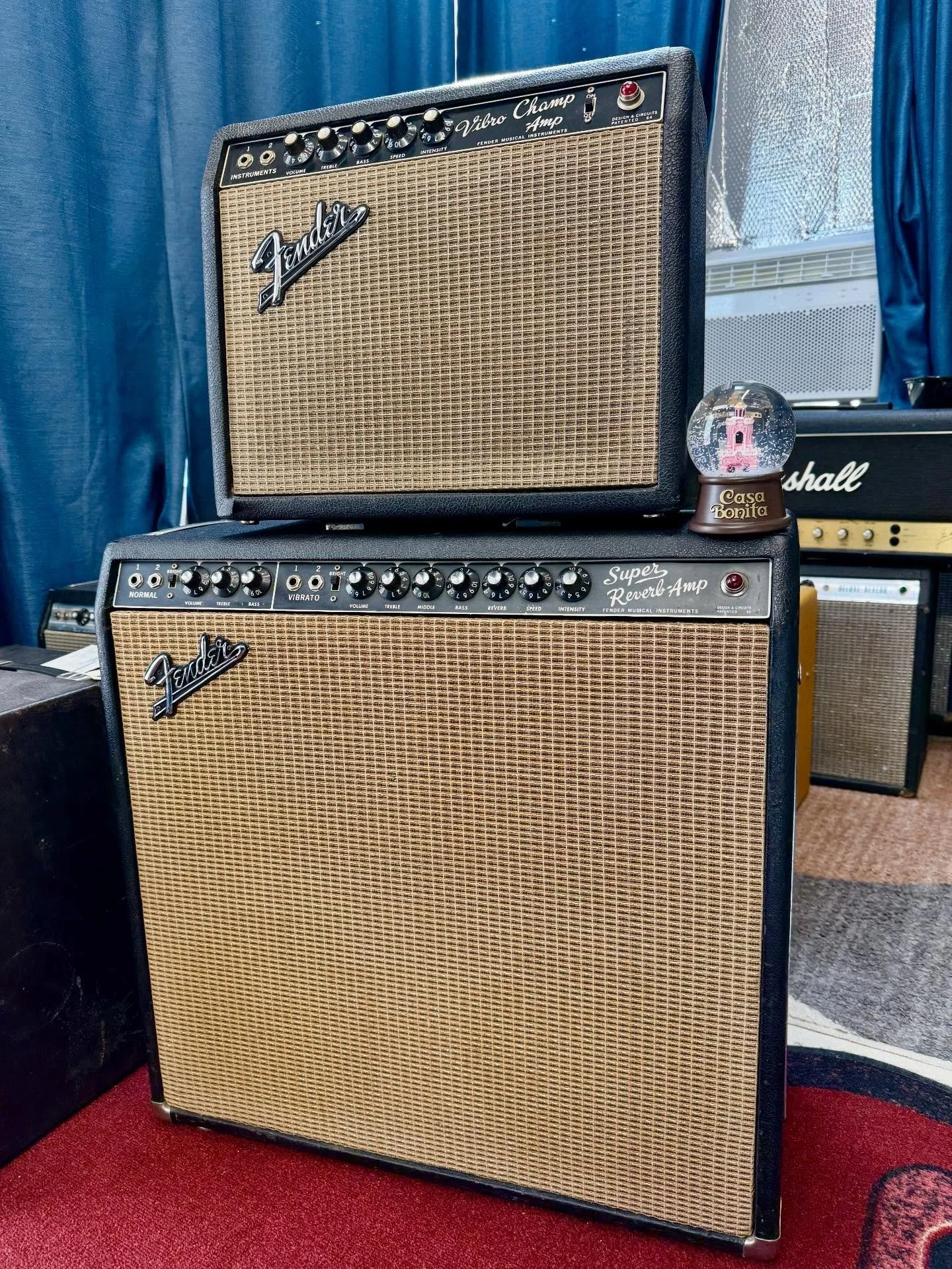 How about a piggyback-ride, papa? This amazing pair of 1966 black-panel Fender amps are in for servicing &mdash; a massive Fender Super Reverb and a cute little Fender Vibro Champ. 

Don&rsquo;t worry, she doesn&rsquo;t mind being called cute, especi