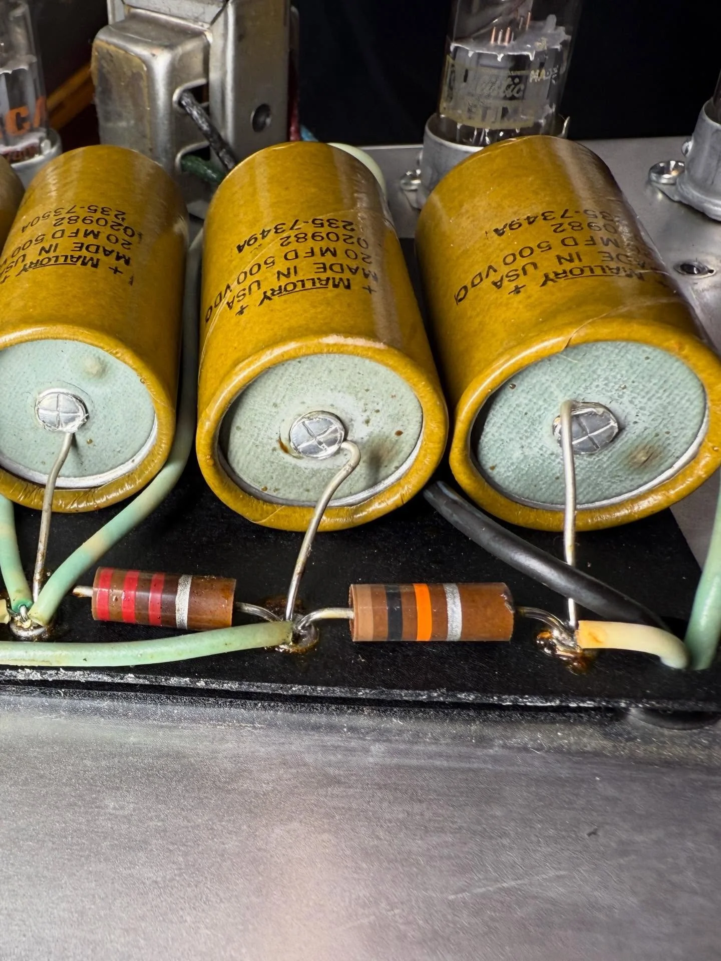 These filter caps from 1973 are looking pimply. Luckily not leaking toxic goo everywhere yet. Time to get them out of there before they do!