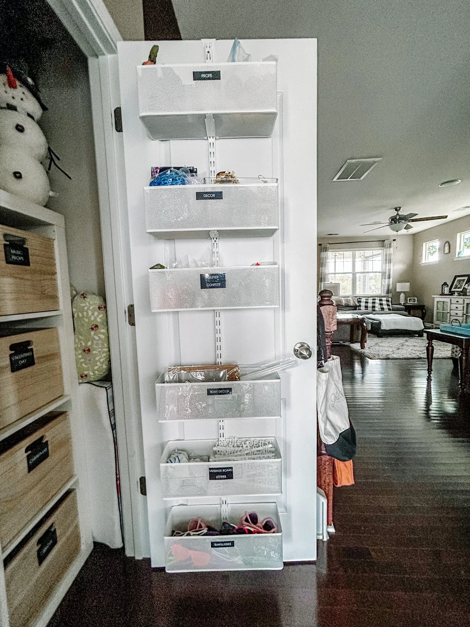 Elfa door organizer for managing seasonal needs like hats, gloves, and scarves