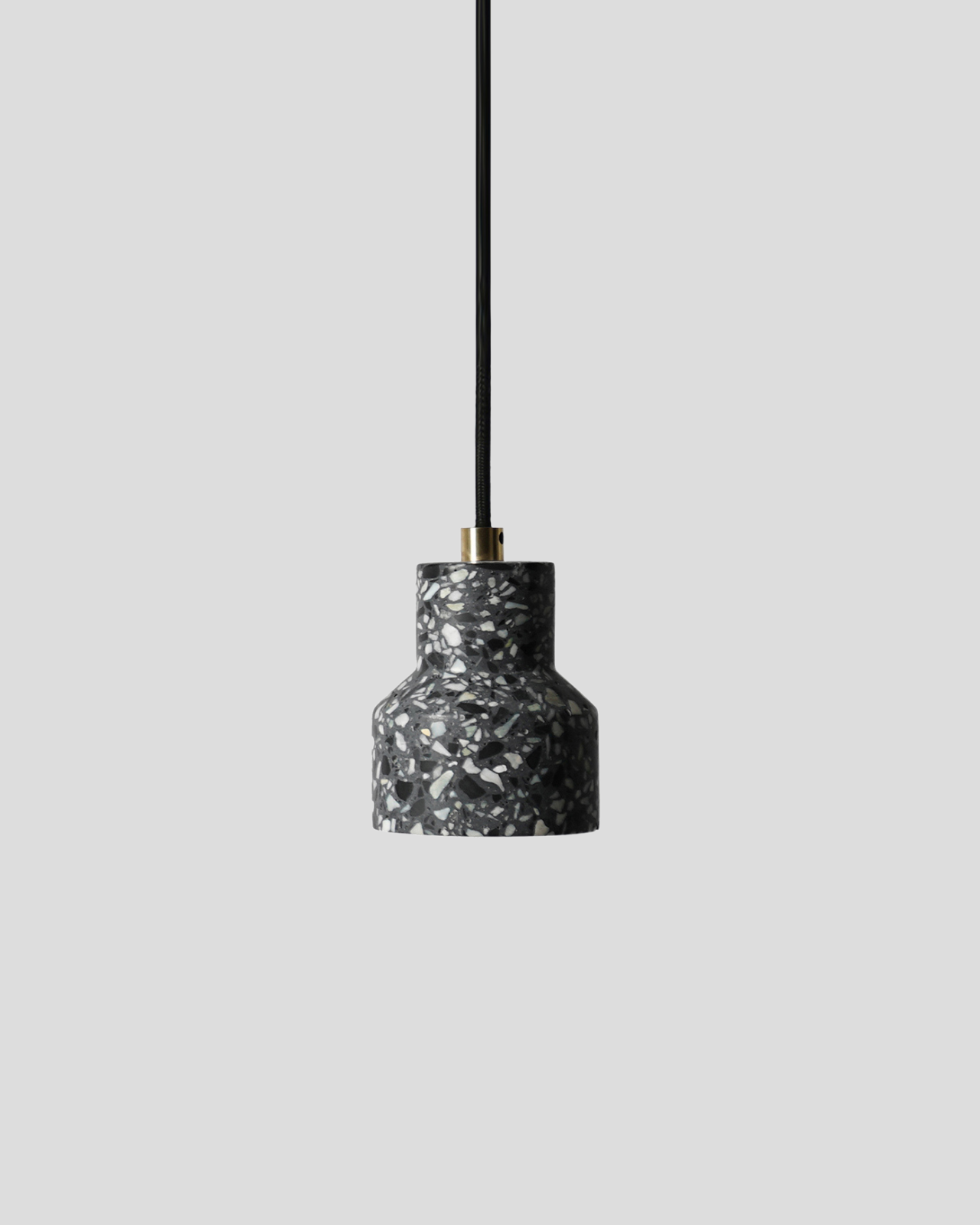 Terrazzo Black Pendant Light with a brass component and black cord