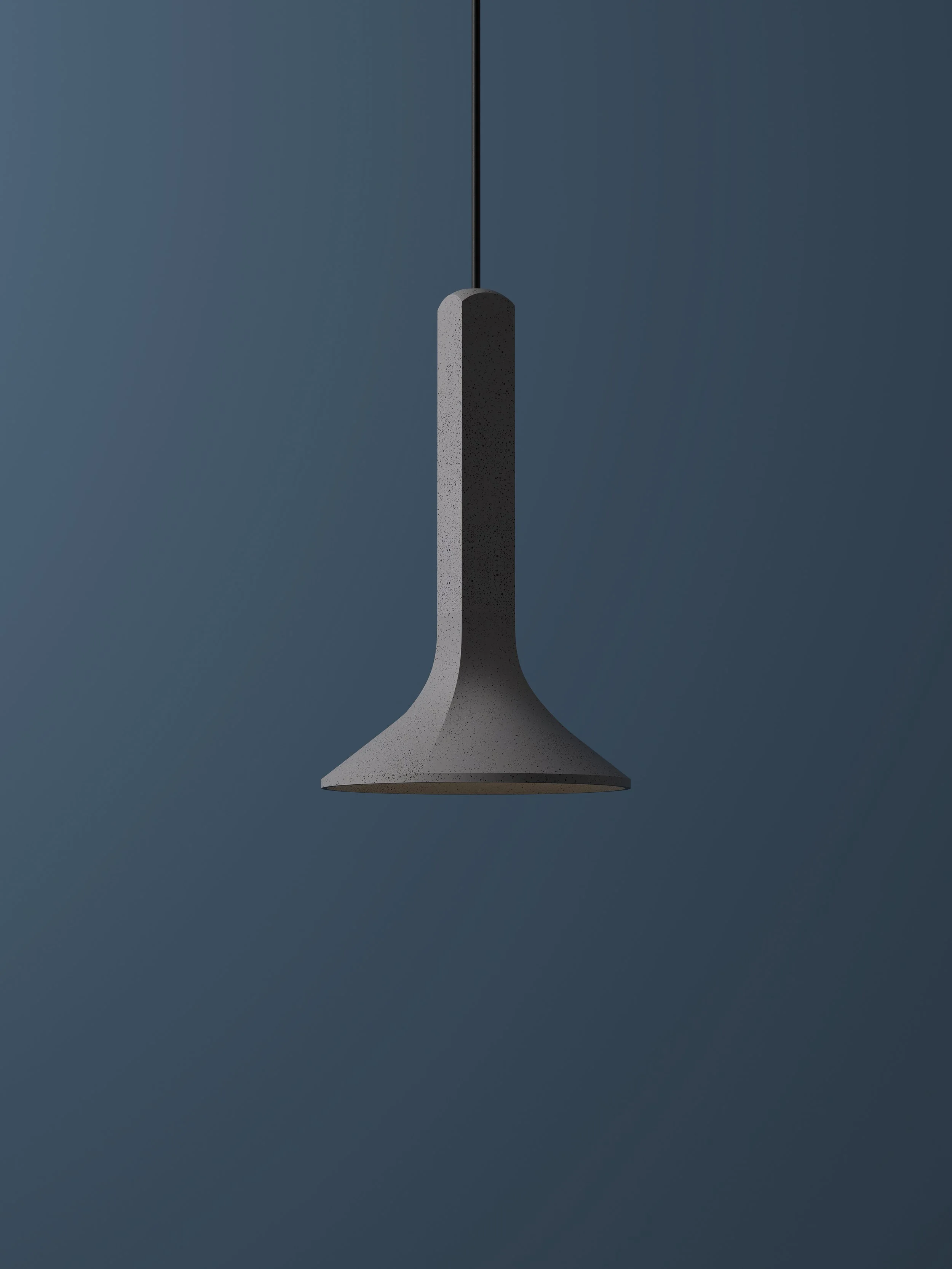 Chuan Concrete Pendant hanging in front of a blue background