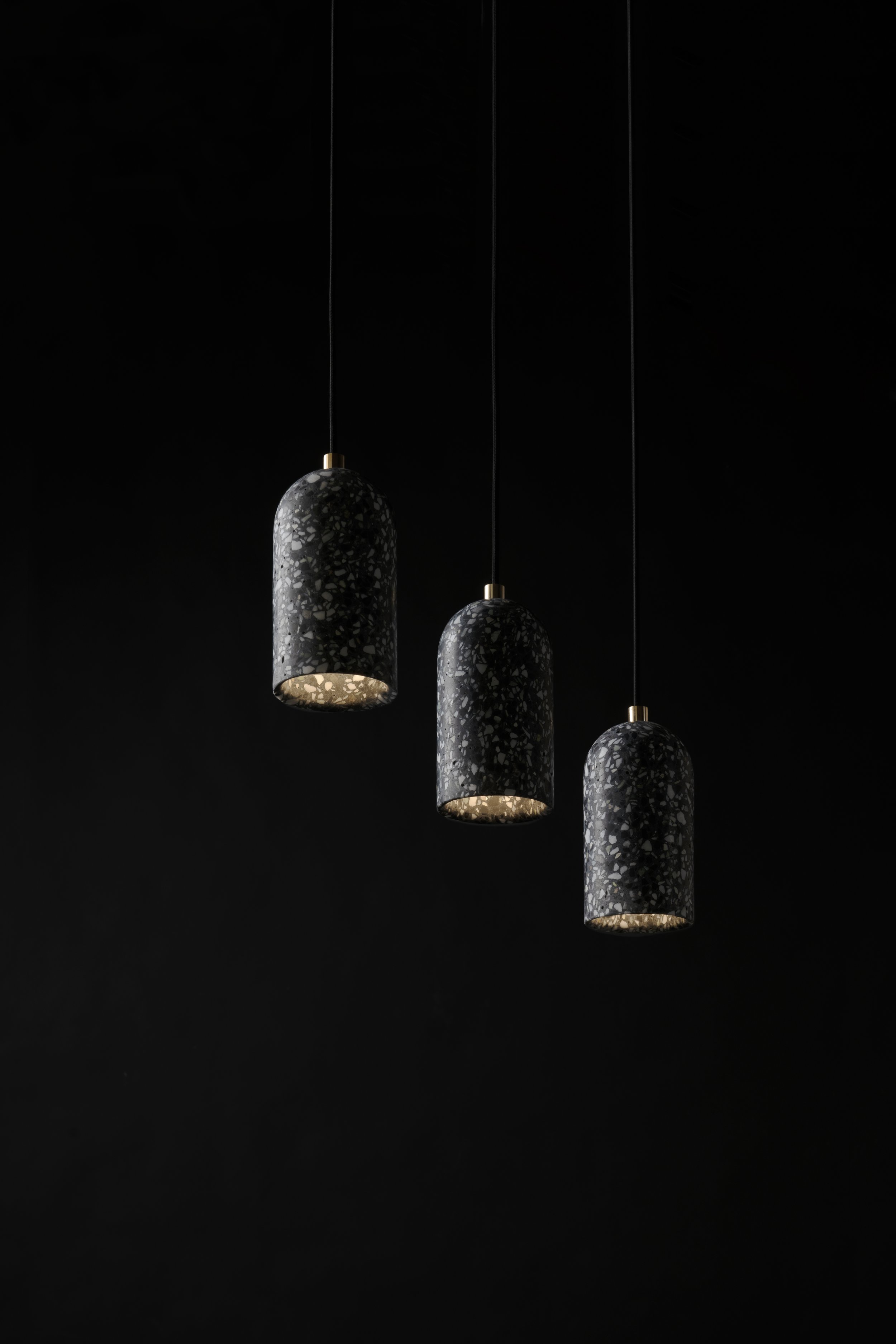 Three Black Terrazzo Pendants hanging at different angles
