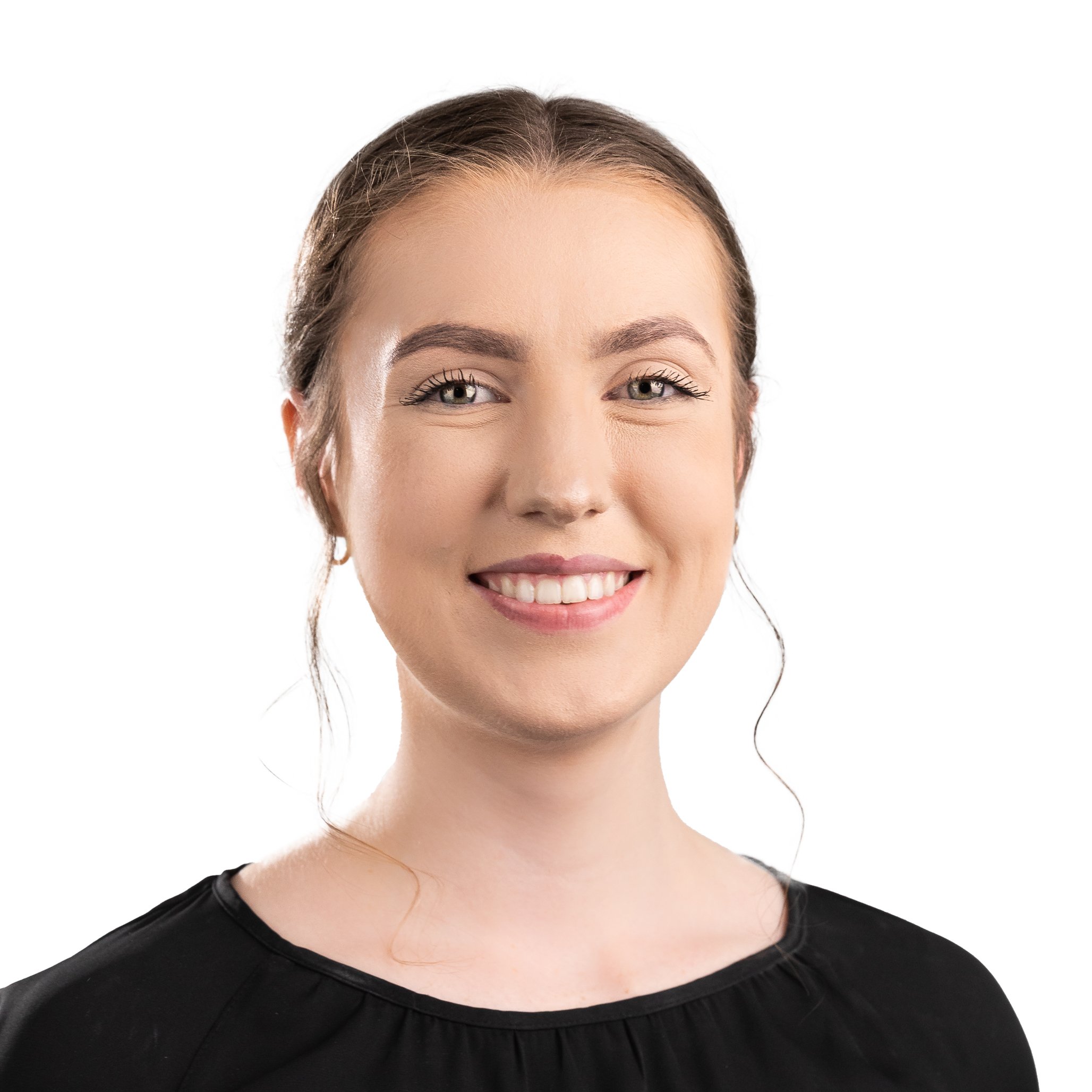Smiling woman with long hair, wearing a black top, against a white background.