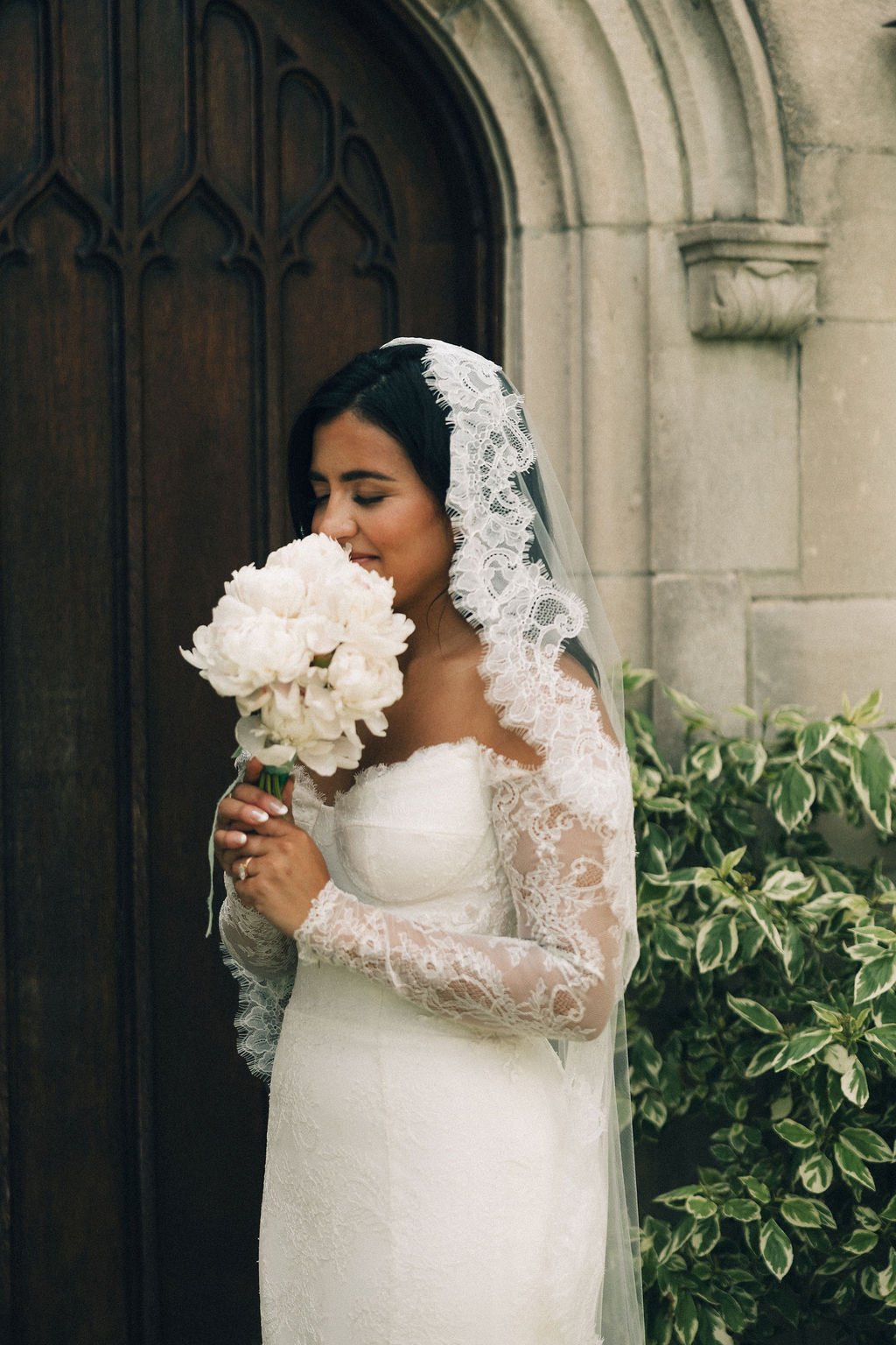 bride holding her peony bouquet