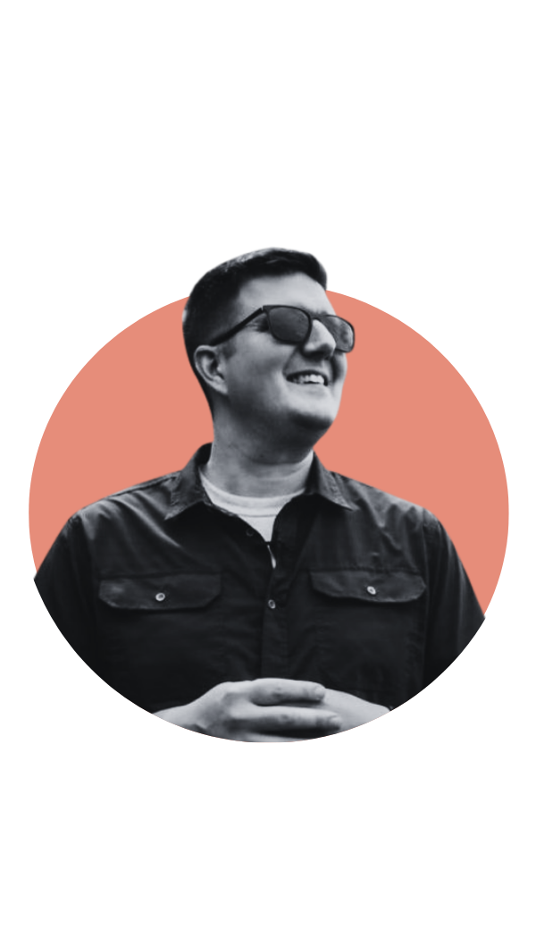 black and white picture with no background, white man pictured in sun glasses, smiling and looking off in the distance