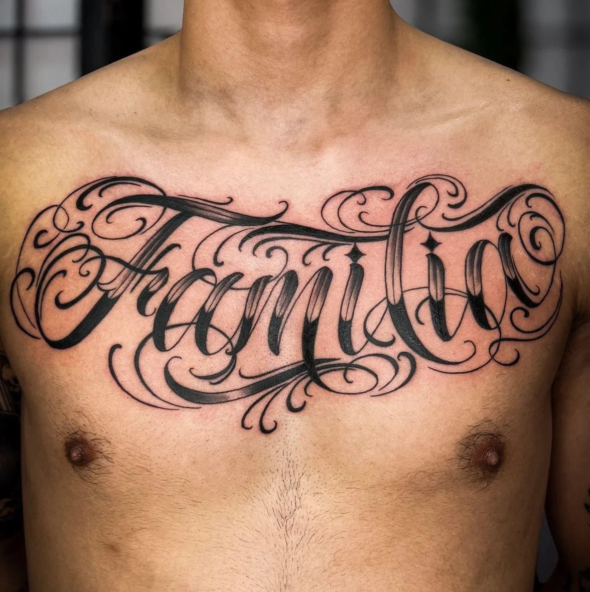 nikita williams custom lettering script chest tattoo sydney