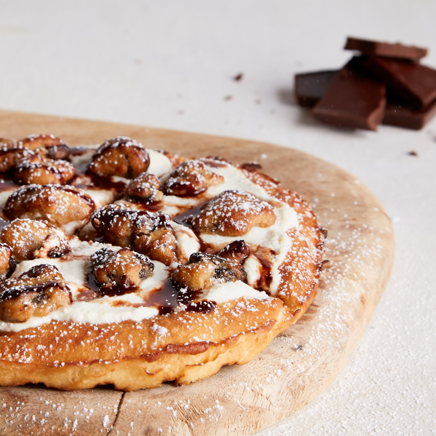 609d9f956e285c5ab0cd2c7f_ChocolateChunkCookiePizza.png