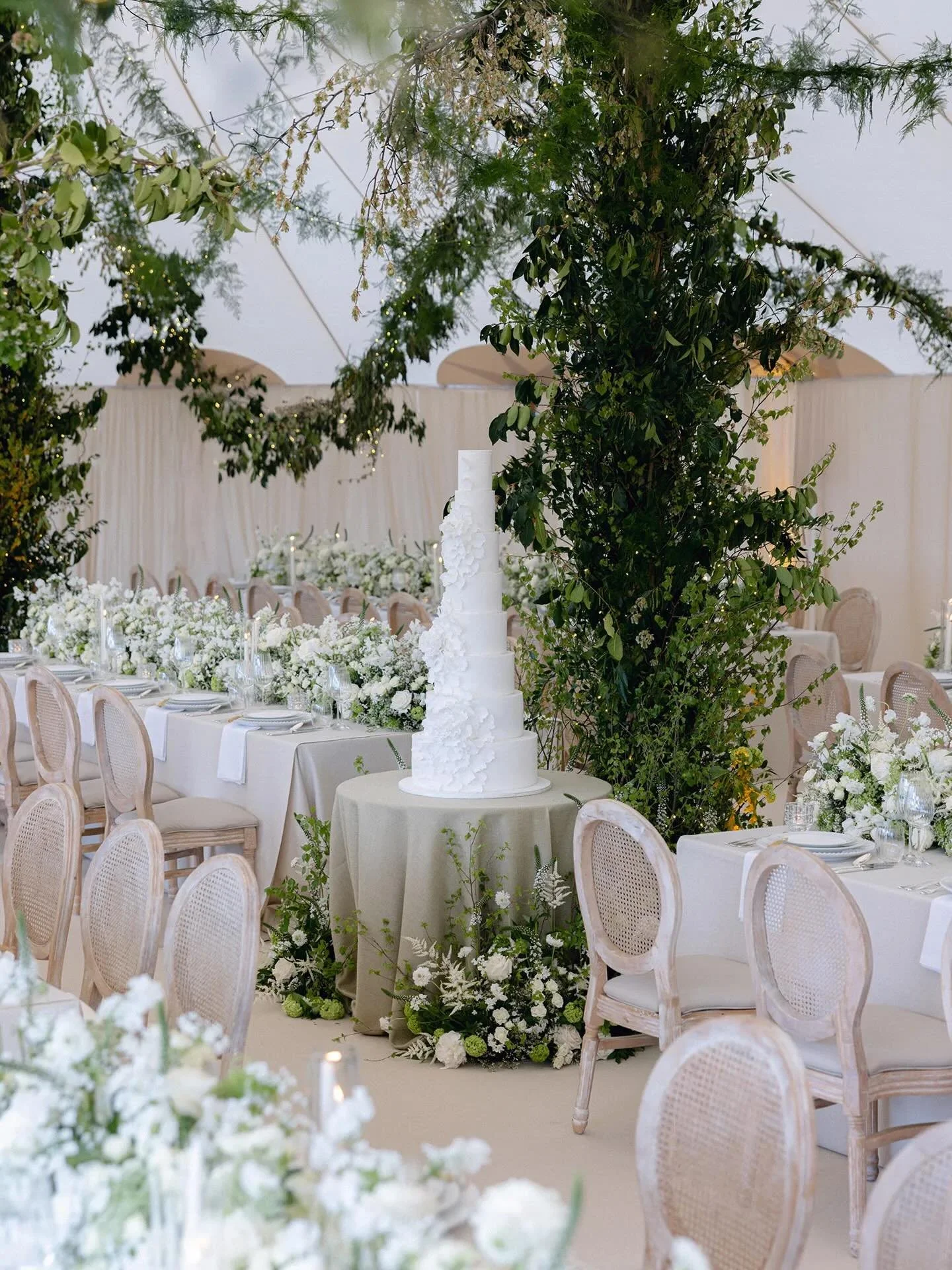 A moment of celebration, beautifully layered.
The wedding cake a traditional multi-tier vanilla sponge by Hall of Cakes became both a centrepiece and a moment in itself. &ldquo;It was so hard to cut&hellip; it took both of us,&rdquo; Jack laughs for 
