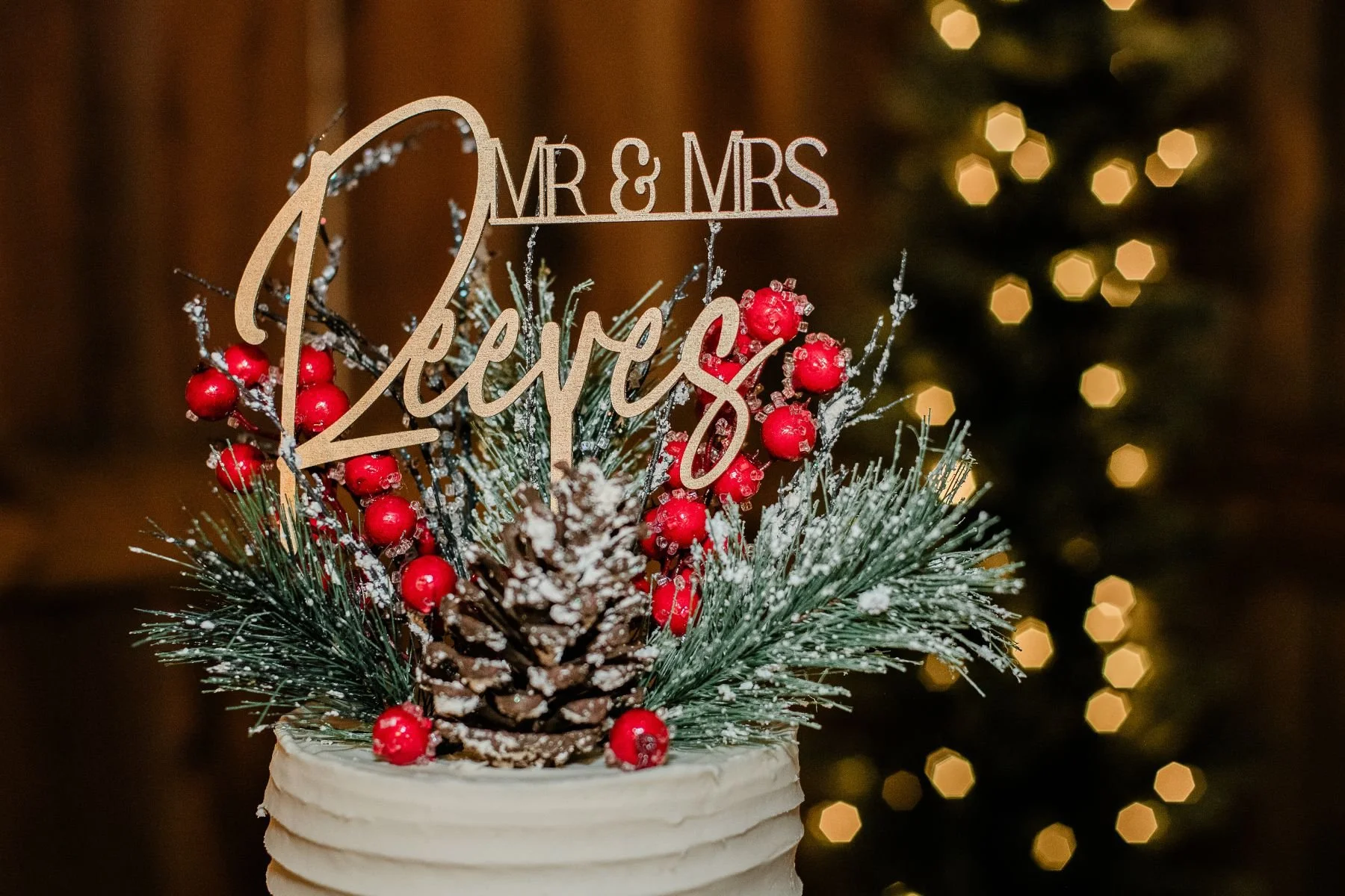 winter wedding cake topper red berries greenery