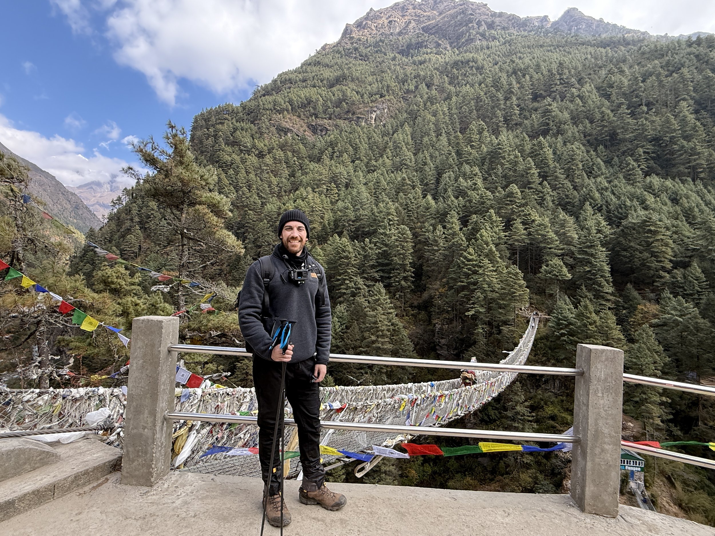 A dramatic crossing of the iconic Hillary Bridge en route to Everest Base Camp.