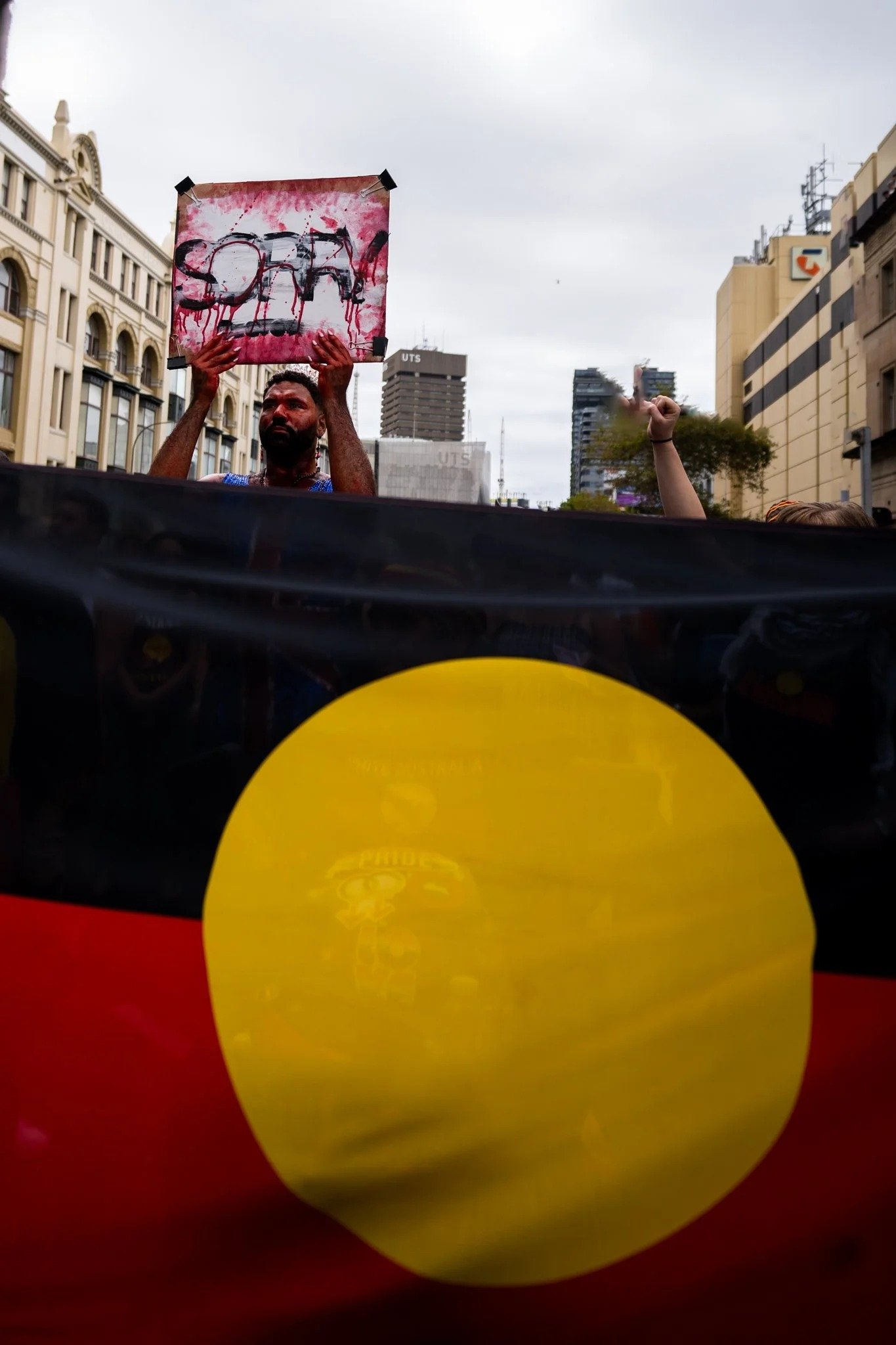 The Aboriginal flag held high on Invasion Day, Sydney