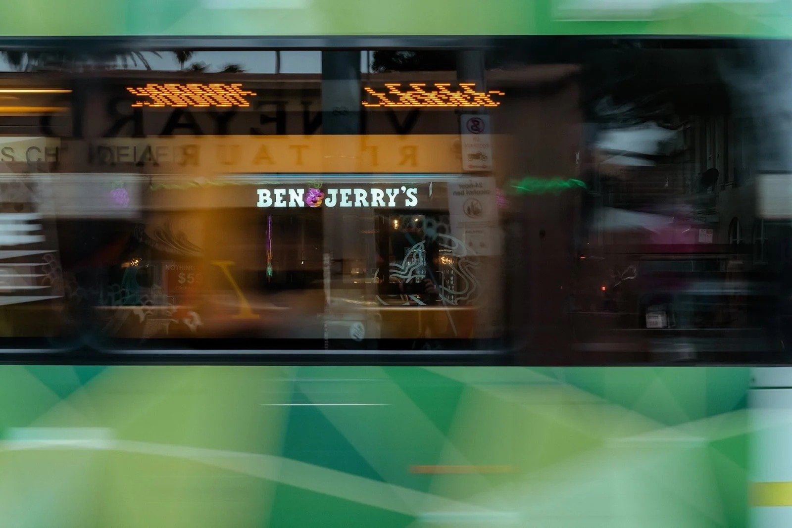 A Ben and Jerry's Scoop Shop in Melbourne with a tram passing