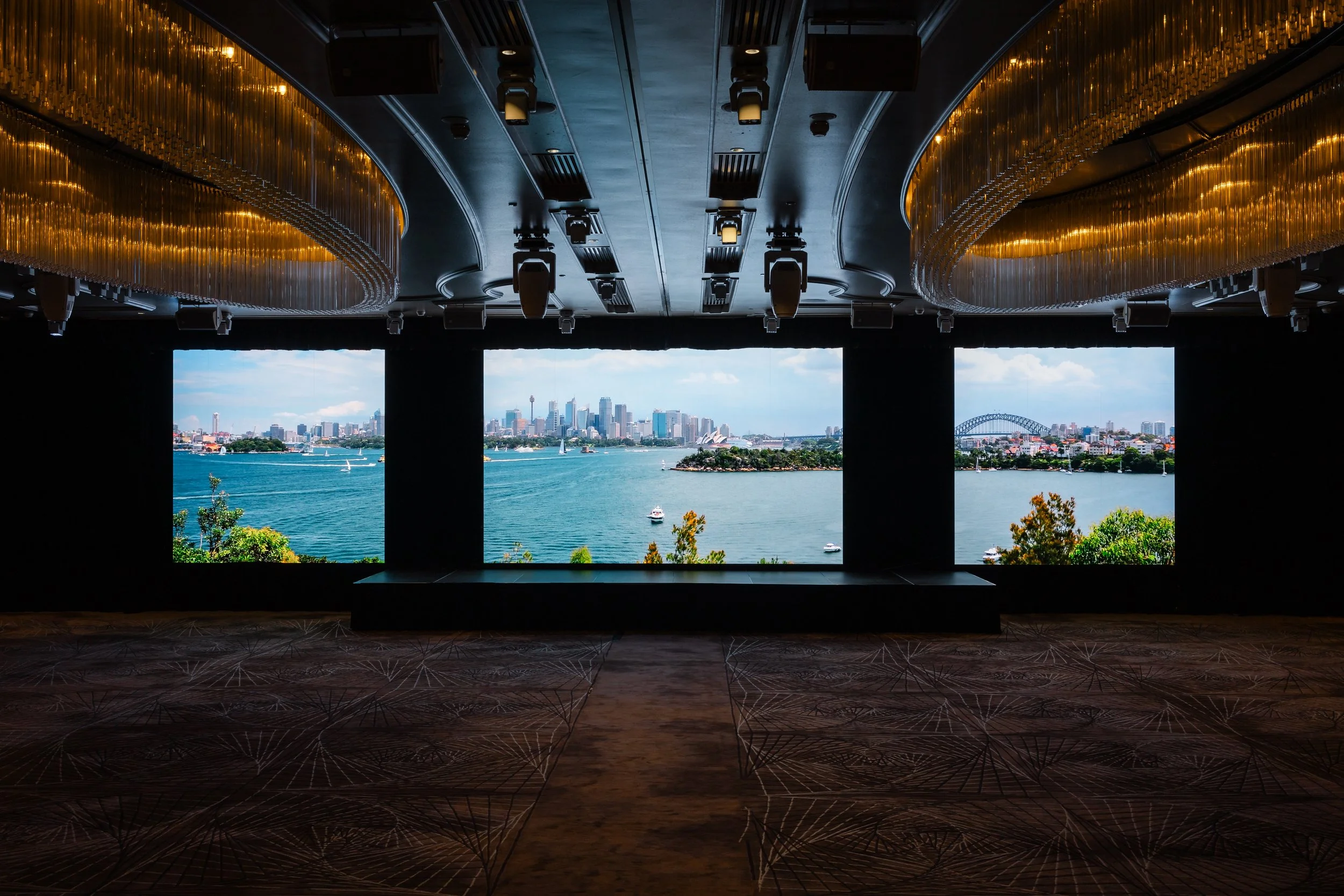 The Grand Ballroom at Shangri-La Hotel, Sydney in neutral light, with images on the wall screens