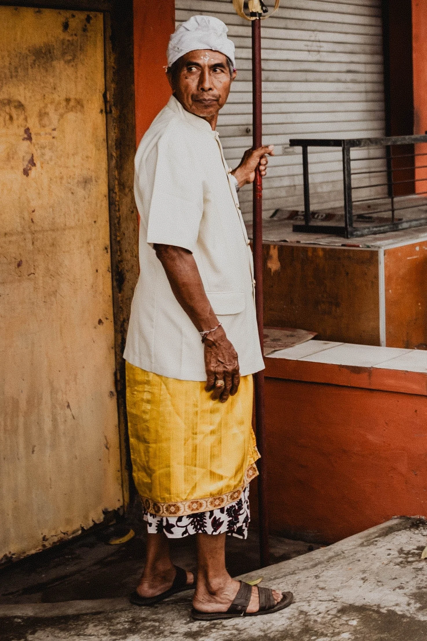 A woman in a doorway on a Bali street