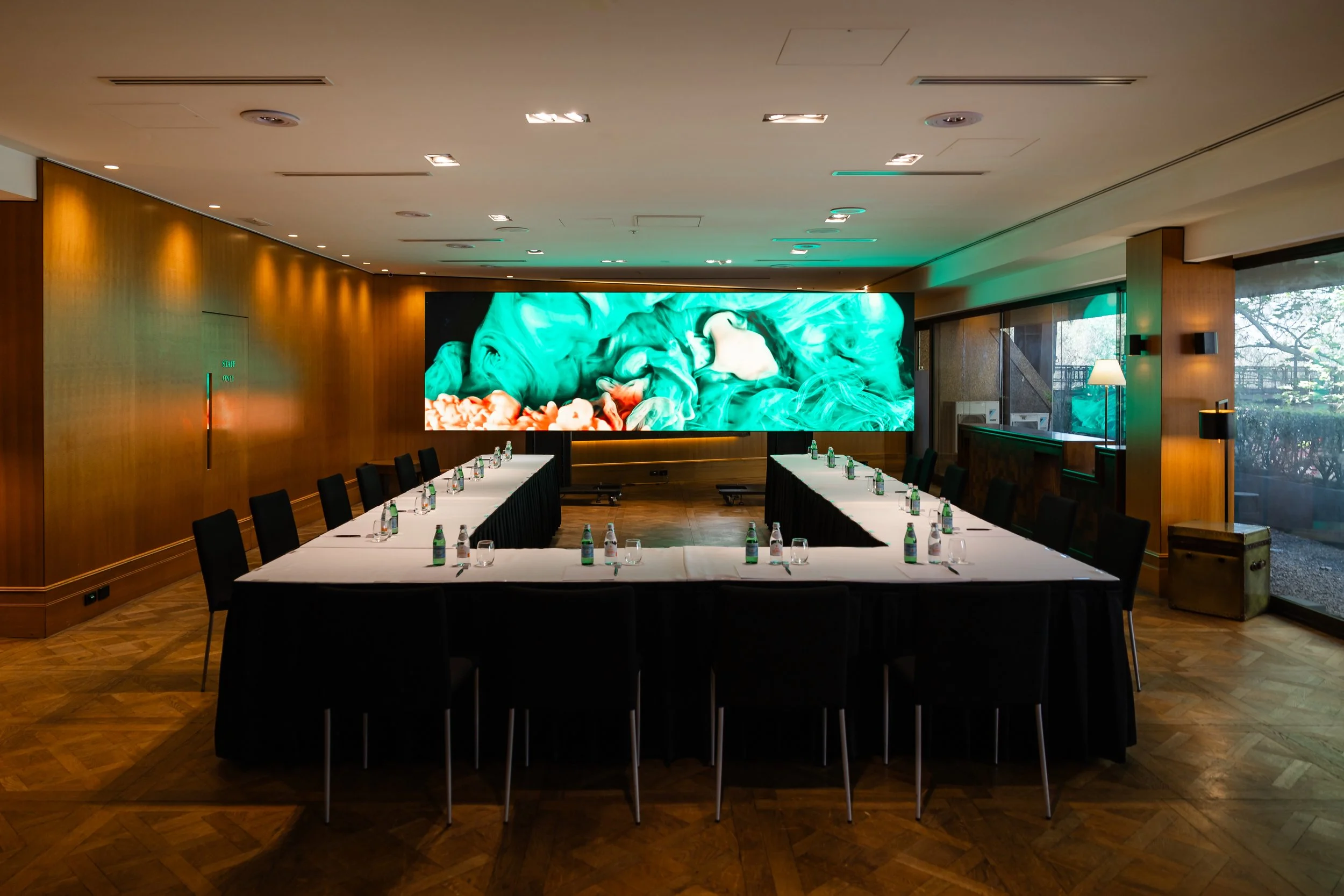 The Residential Suite at Four Seasons Hotel Sydney, set boardroom style in front of a screen