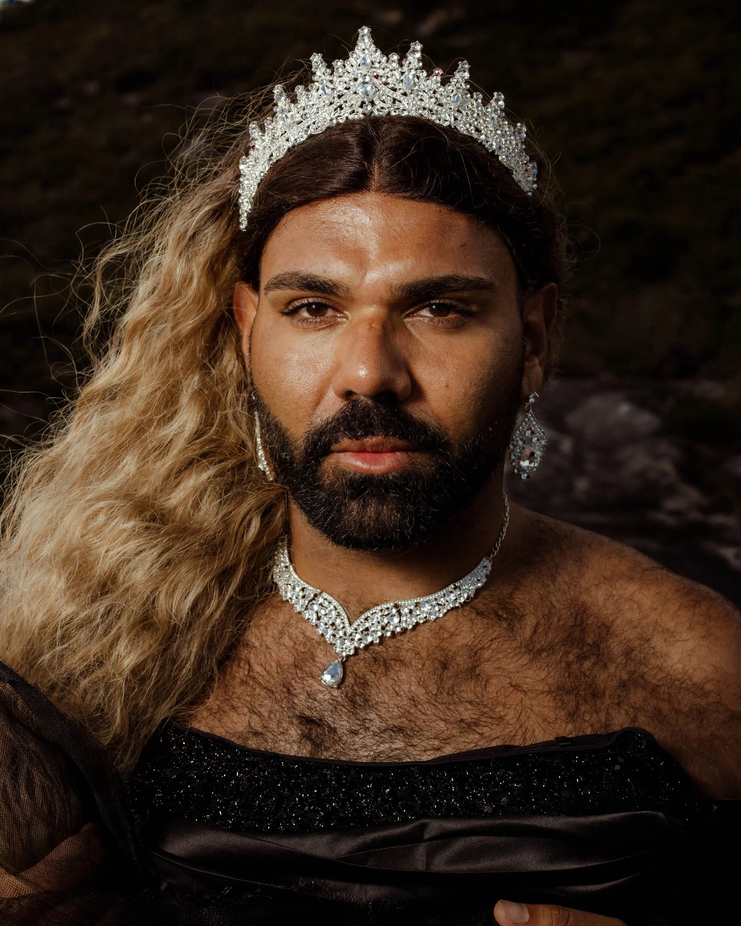 Shaede in a crown and diamanté necklace. The Shaede Project, 2025