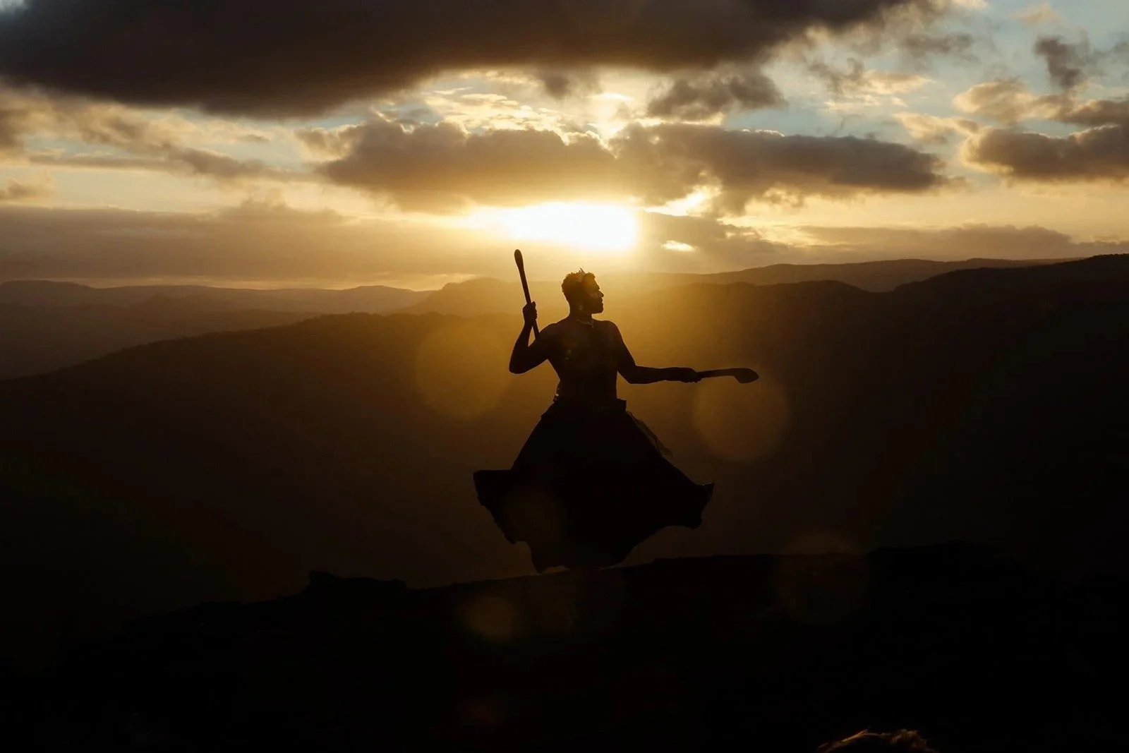Dylan "Shaede" Hoskins in silhouette, dancing on a ridge at sunset, The Shaede Project