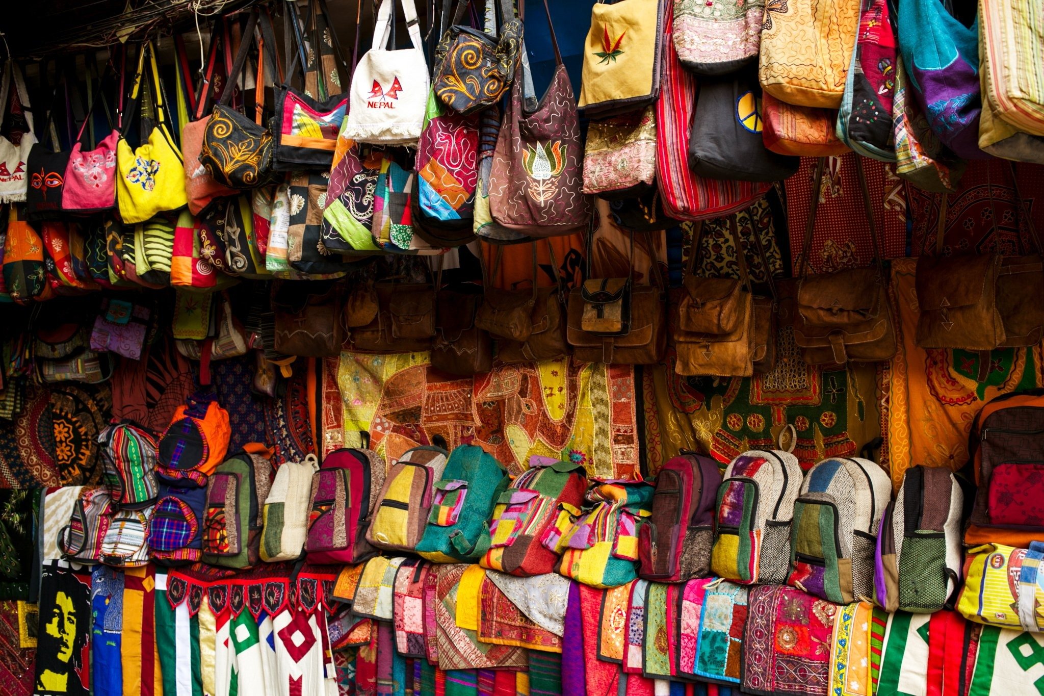 A stall of bright textiles and bags in Rajasthan