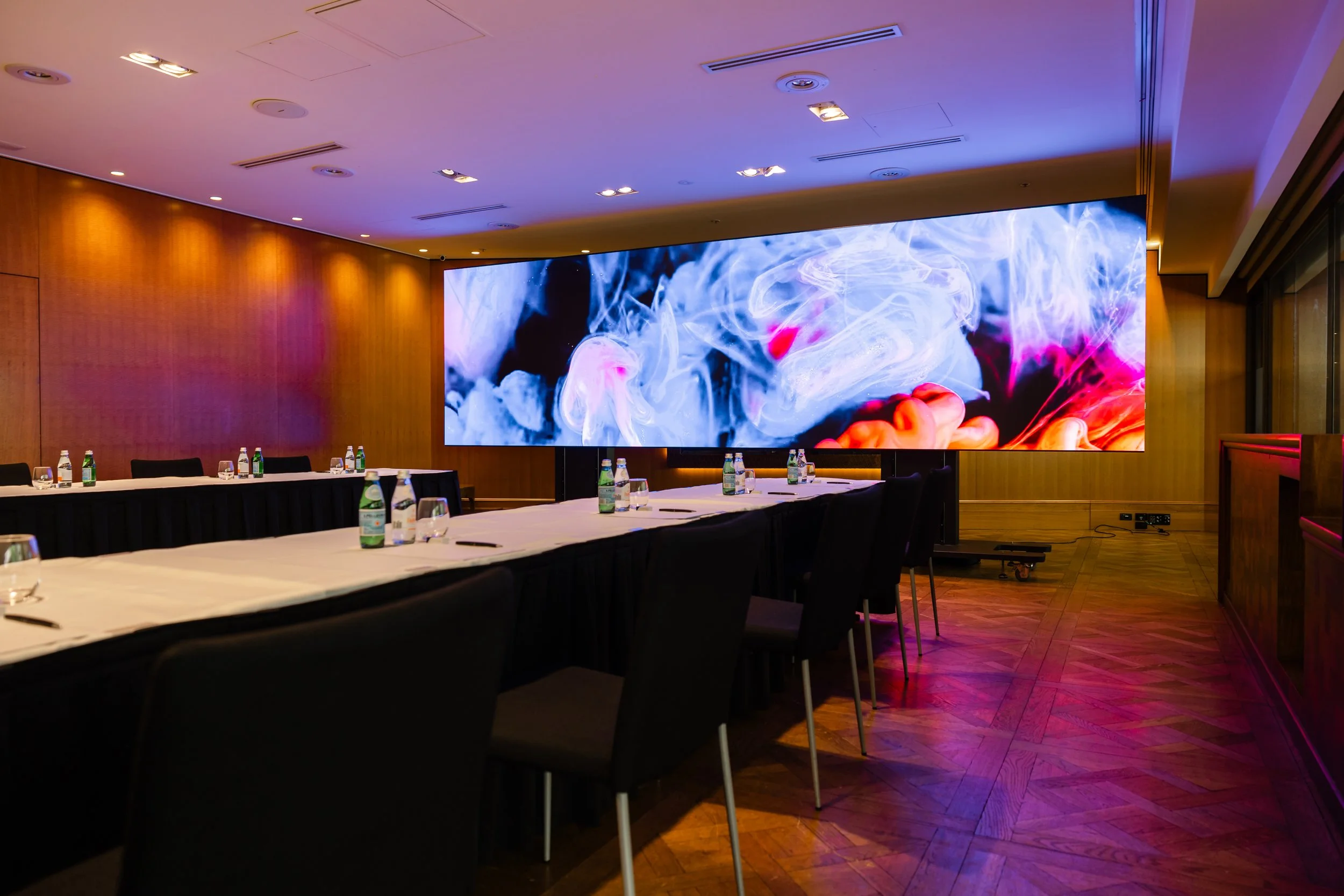 The Residential Suite at Four Seasons Hotel Sydney, with a screen at the head of the room