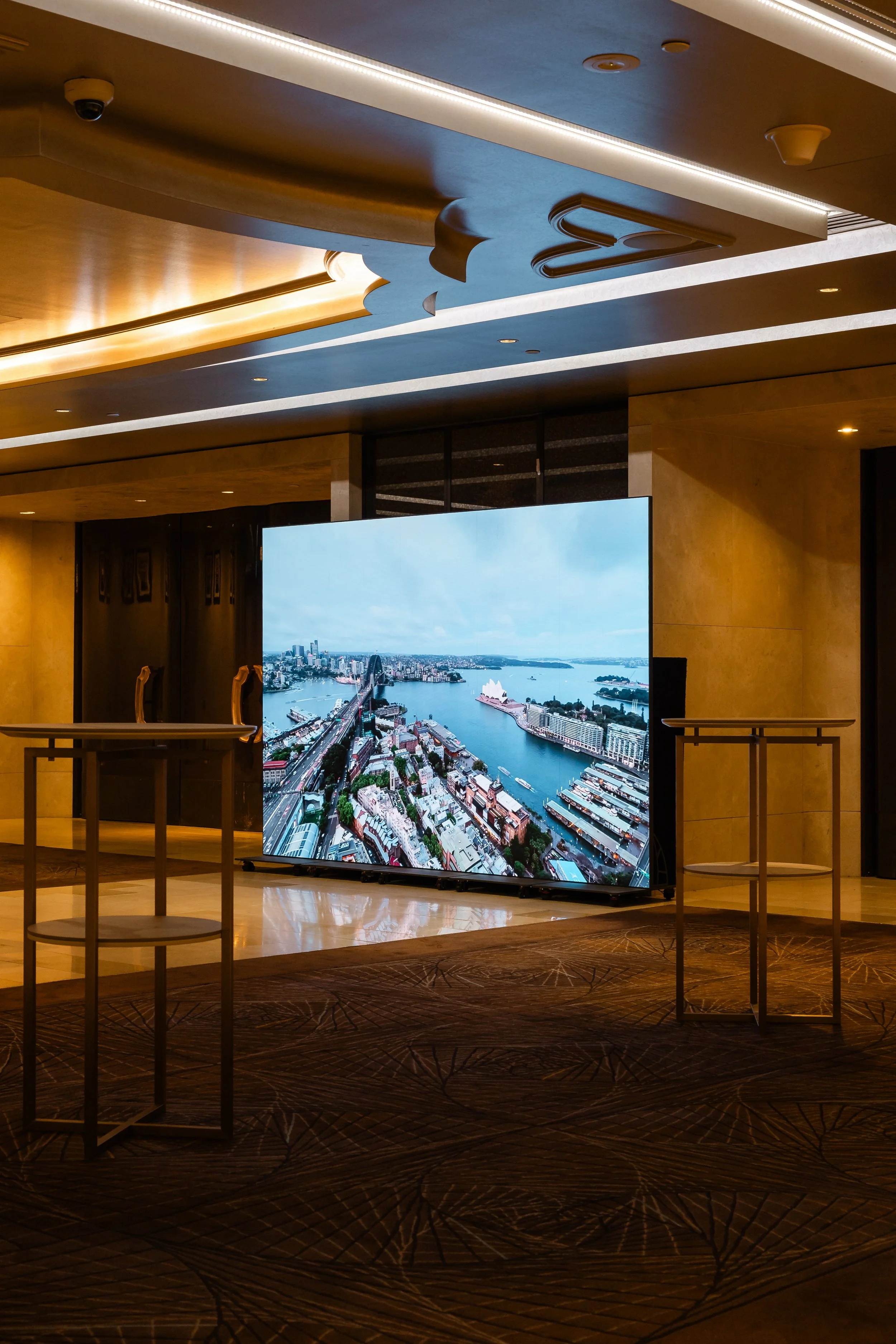 The main LED screen in the Grand Ballroom at Shangri-La Hotel, Sydney, showing a harbour image