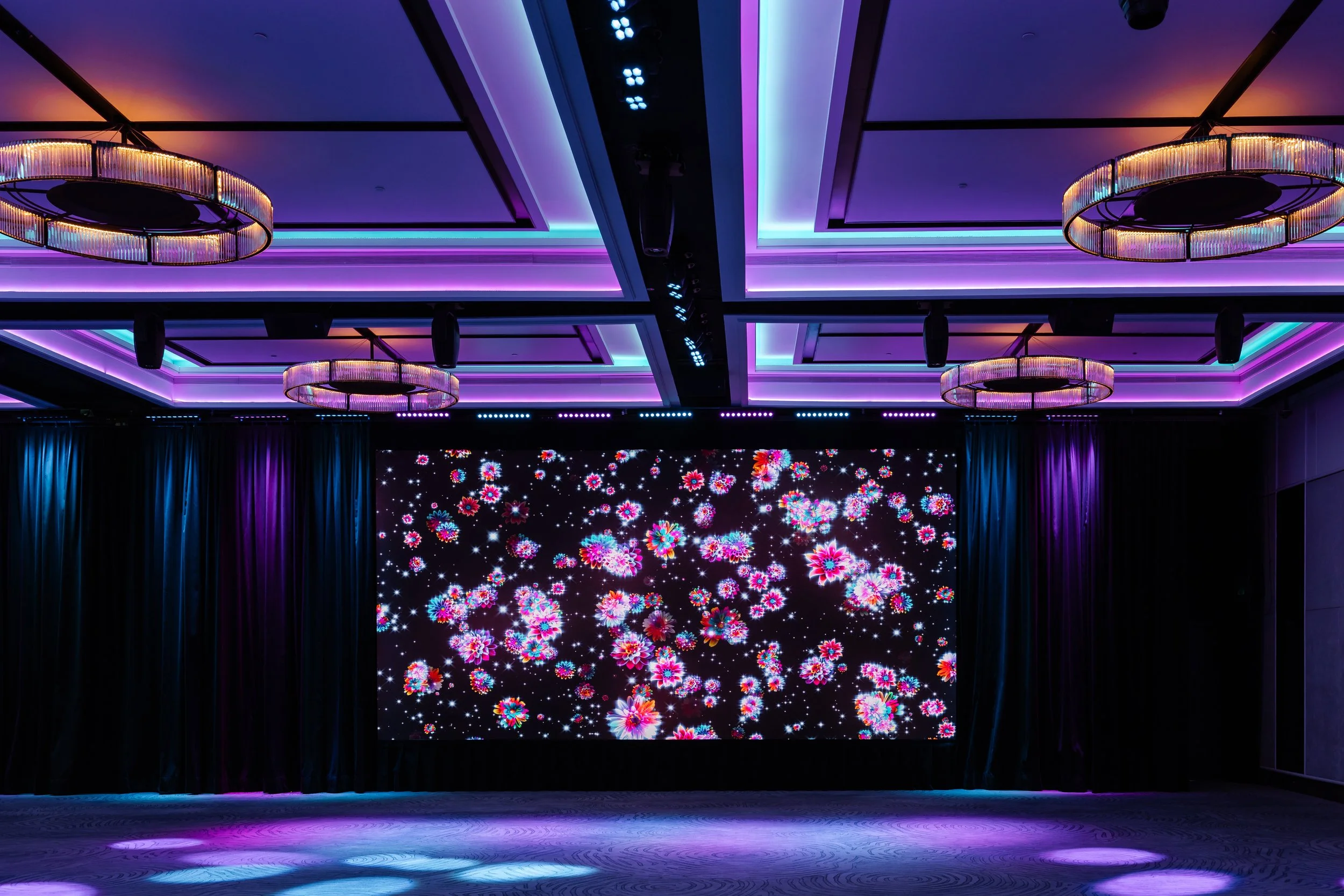 The Grand Ballroom foyer at Four Seasons Hotel Sydney, with images on the screen