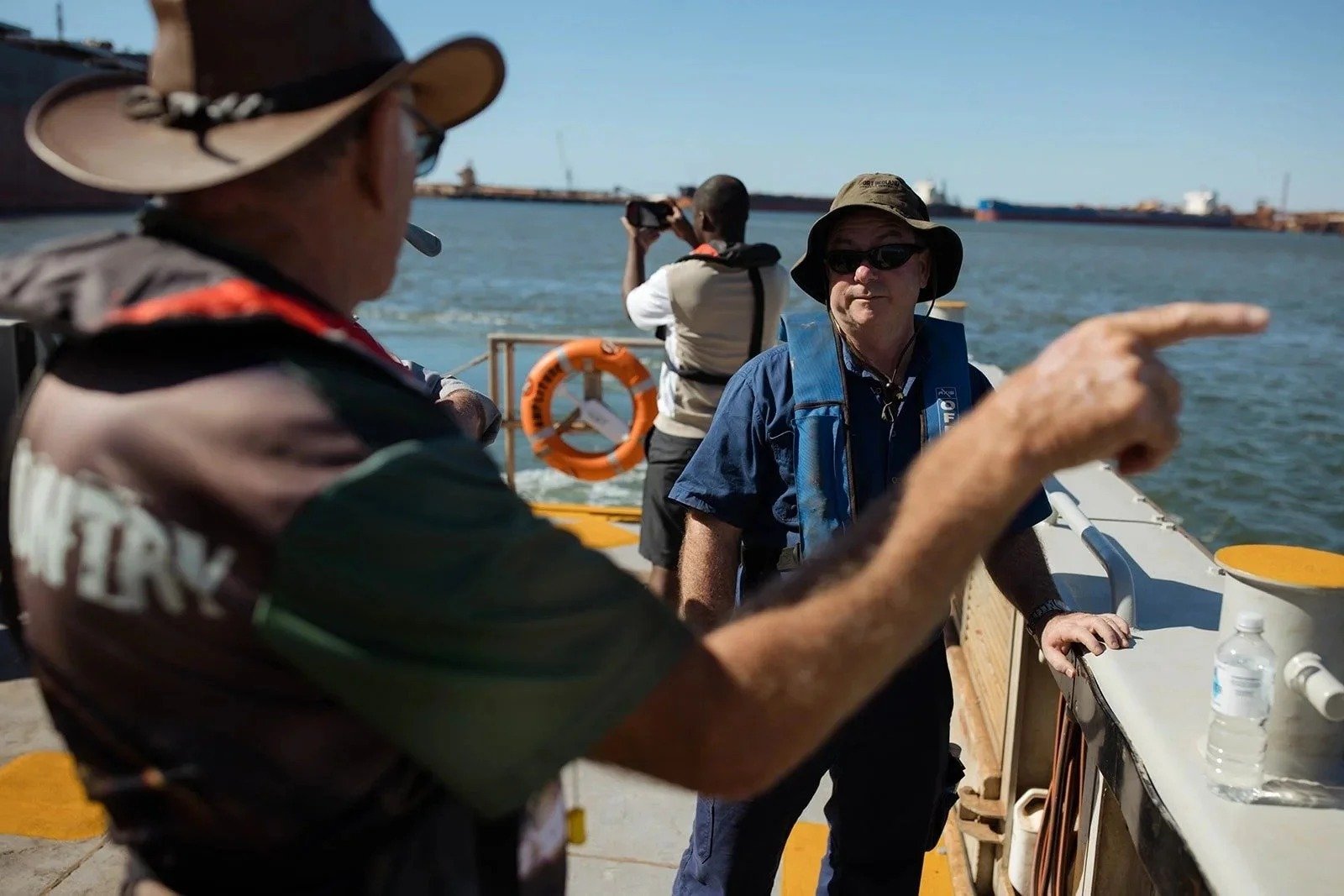 Mission to Seafarers staff and crew on the deck of the harbour launch in Port Hedland