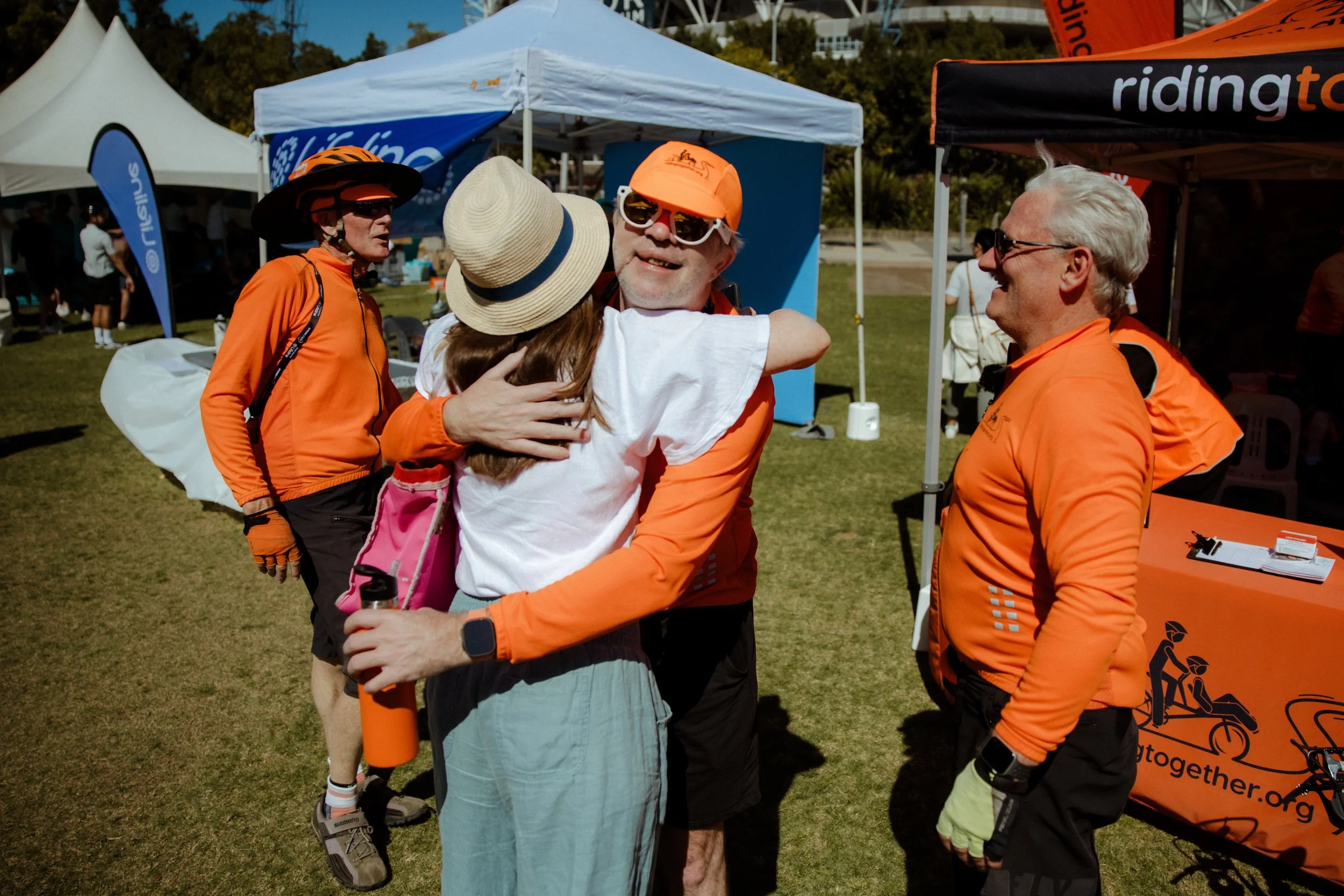 A hug at the Riding Together tent after Spring Cycle