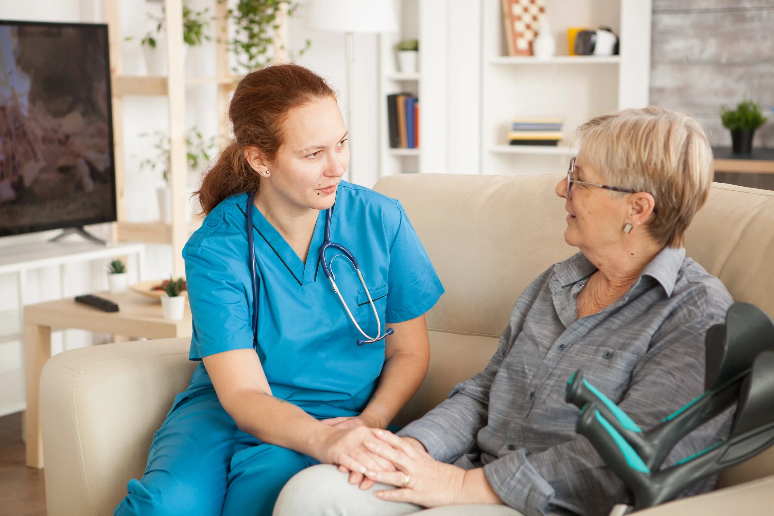 female-nurse-having-conversation-with-pensioner-woman-nursing-home.jpg