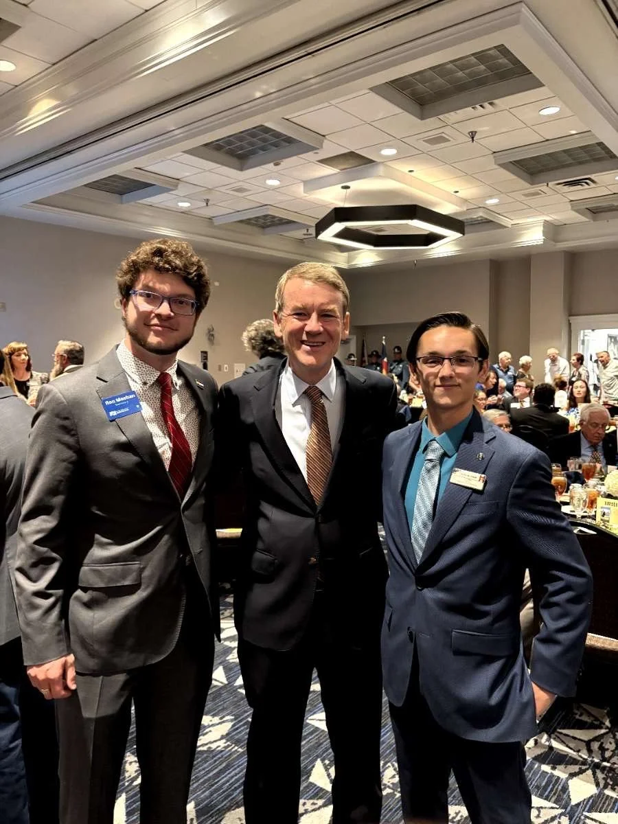 Christian Seale, candidate for El Paso County Commissioner District 5 with Michael Bennet at Adams County Dinner