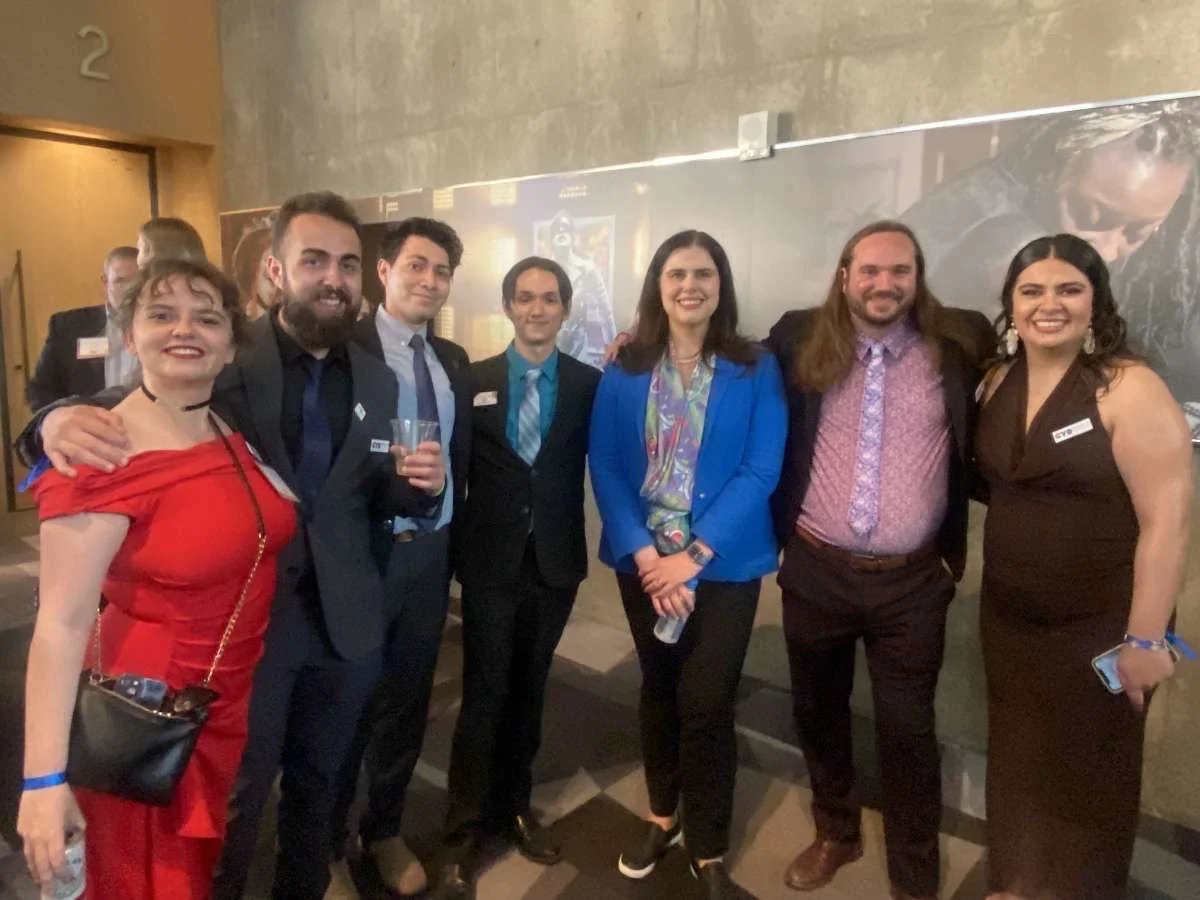 Group of seven people including Christian Seale, candidate for El Paso County Commissioner District 5 dressed in formal attire posing together at an event.