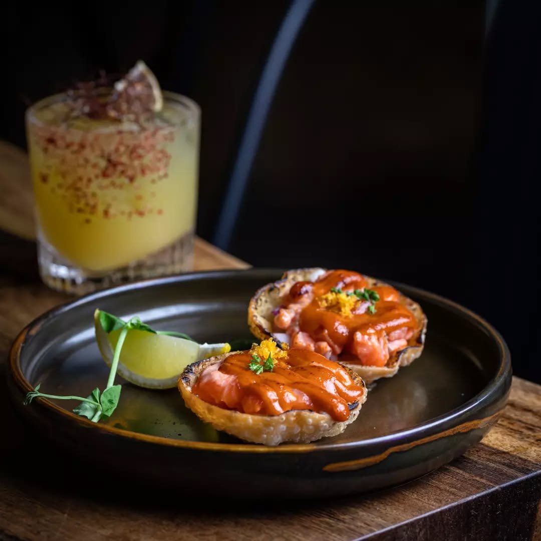 Forget the office, the real work starts at the table 🌮✨ Dive into our Salmon Tacos on crispy dumpling skin to kickstart the weekend early. See you under the neon from 5 PM!