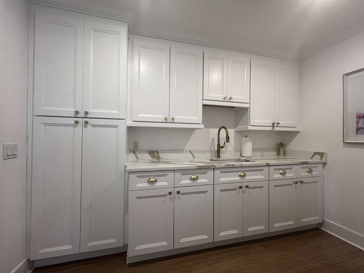 This laundry room is a good example of how staggered cabinet depth can make a built-in feel more intentional and more custom.

By allowing the pantry, base cabinets, and wall cabinets to sit at different depths, the overall design gains more dimensio