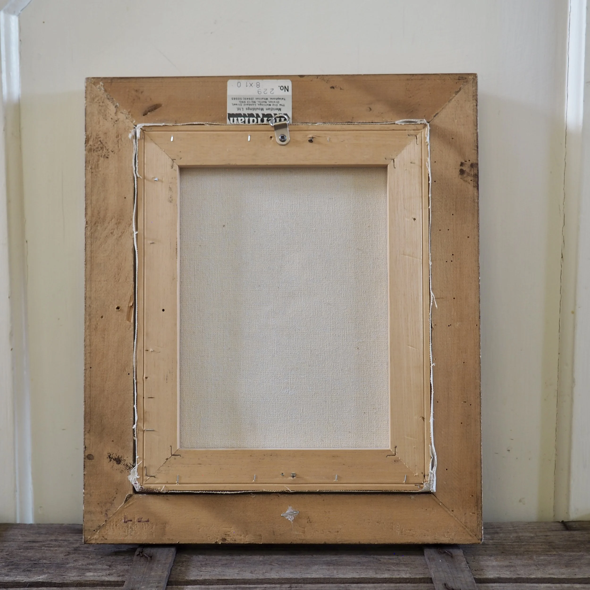 reverse of a framed oil painting