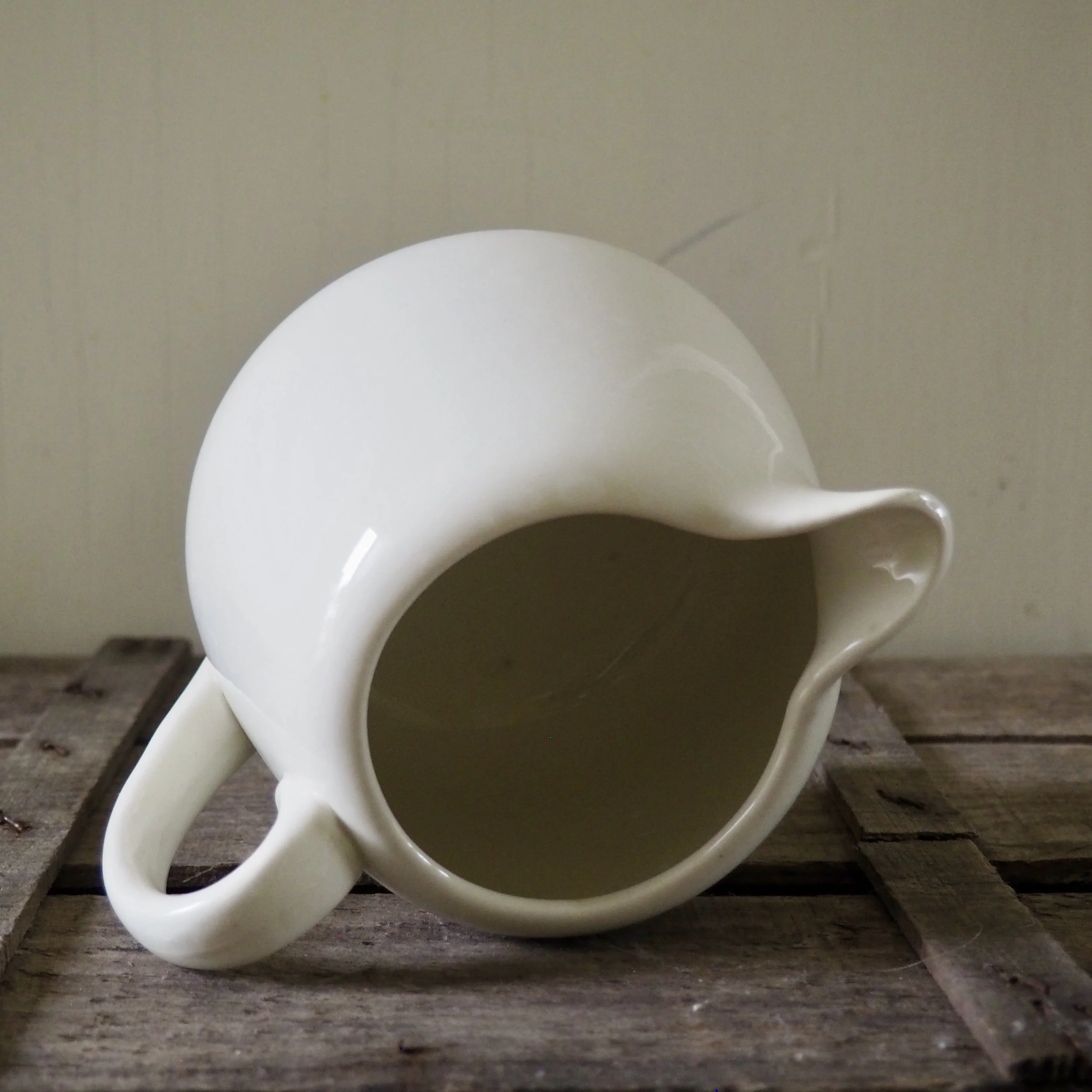 top view of a white jug on its side