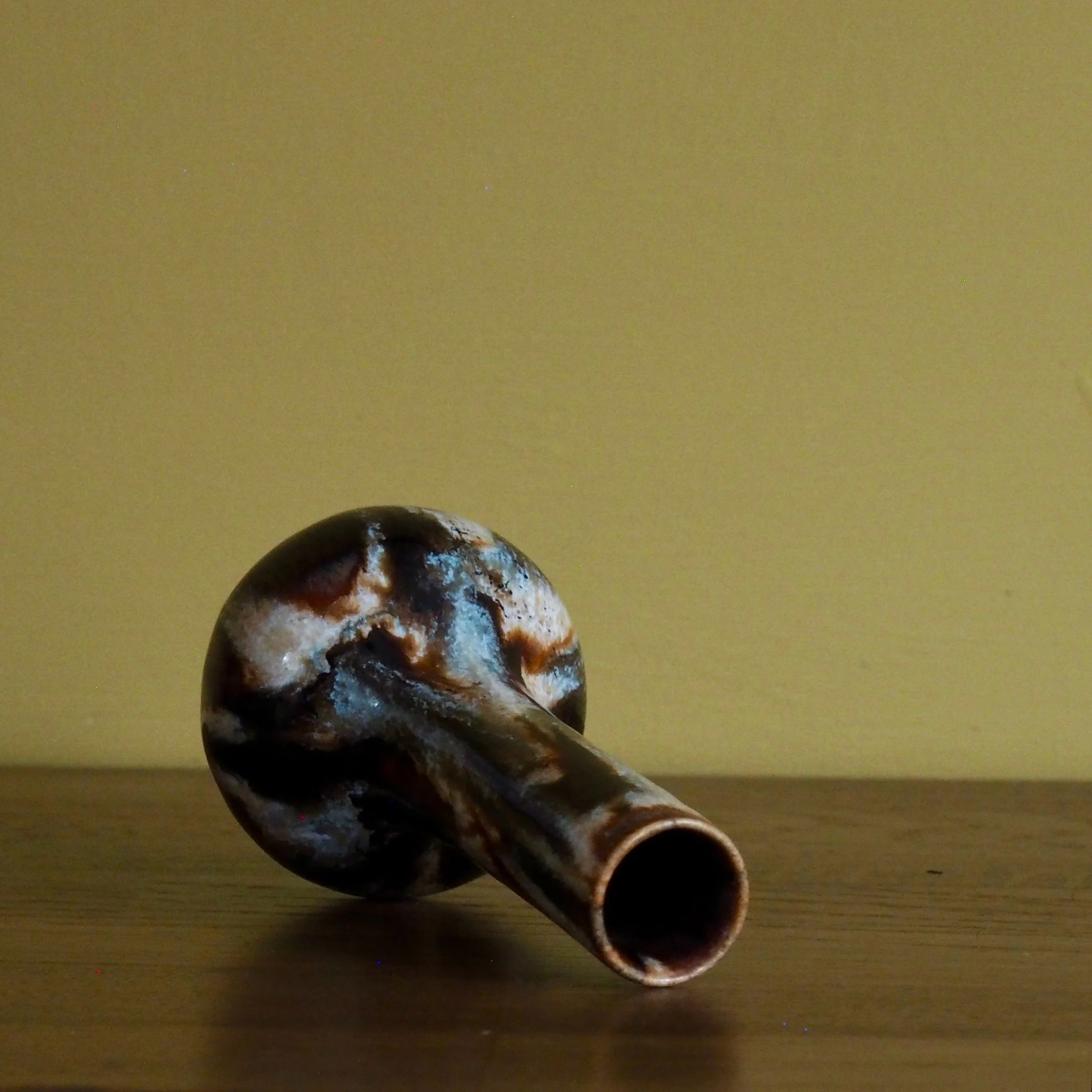 small glazed stem vase side view