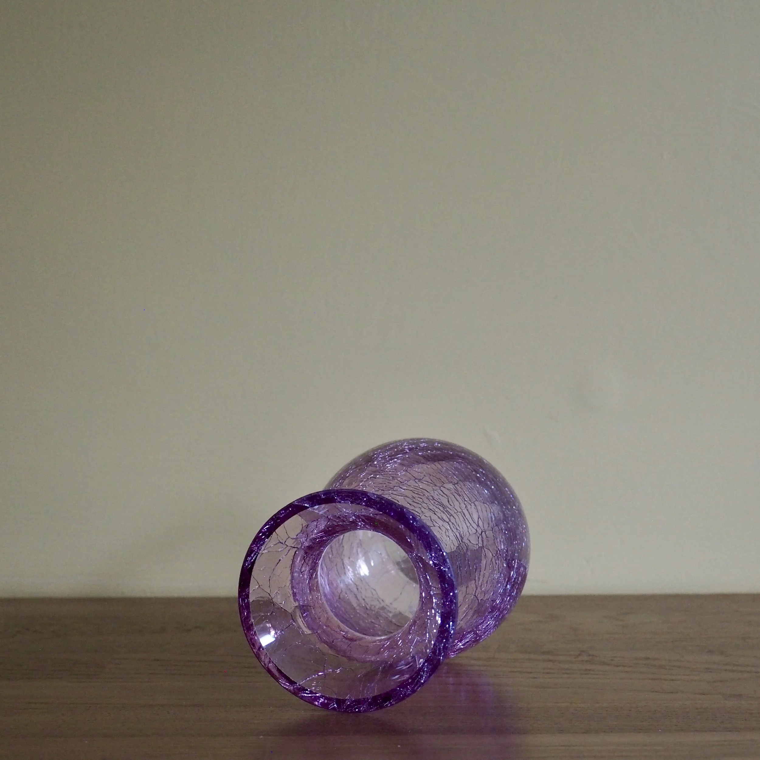 Pink vintage crackle glass vase Lying on its side, top view