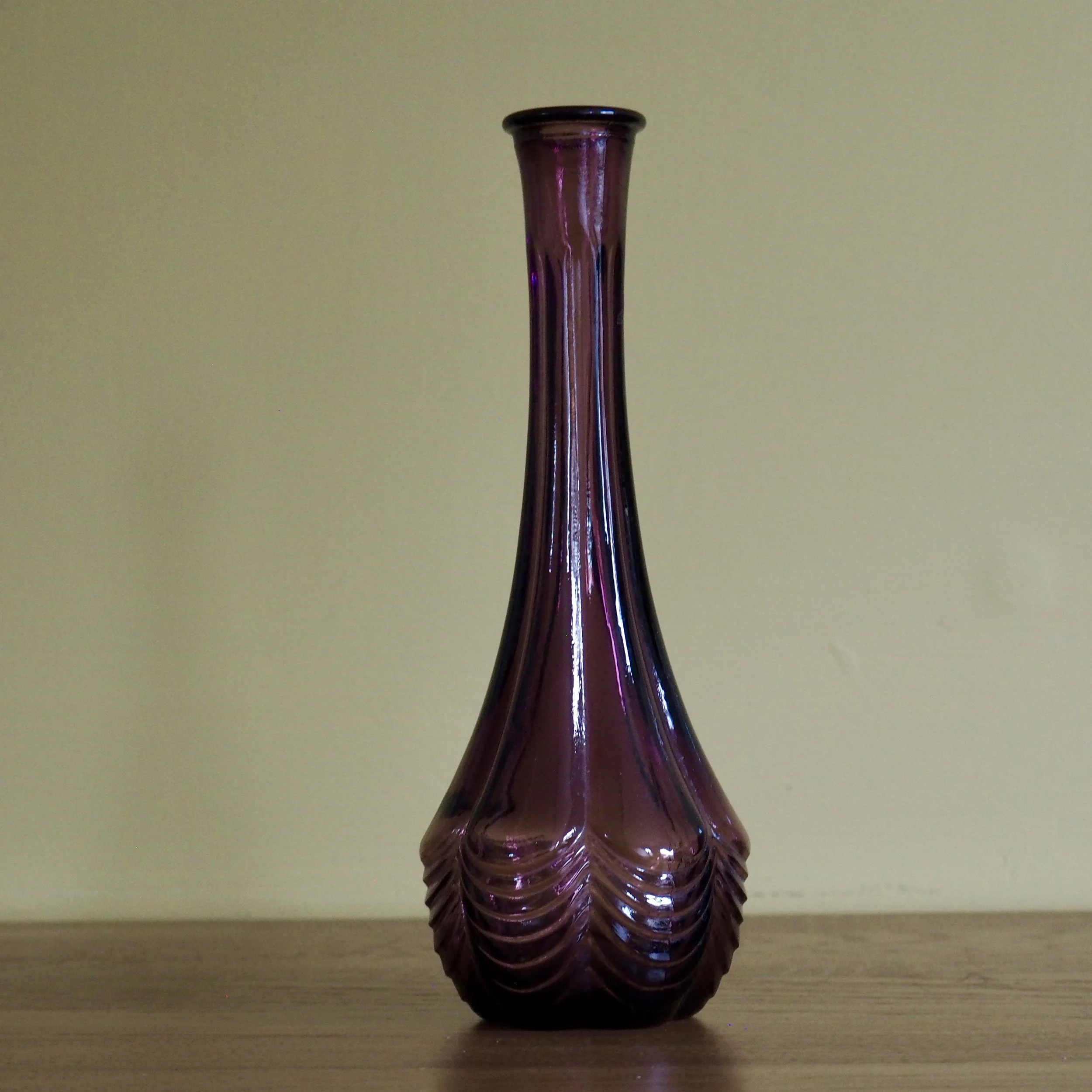 Tall vintage purple Avon stem vase