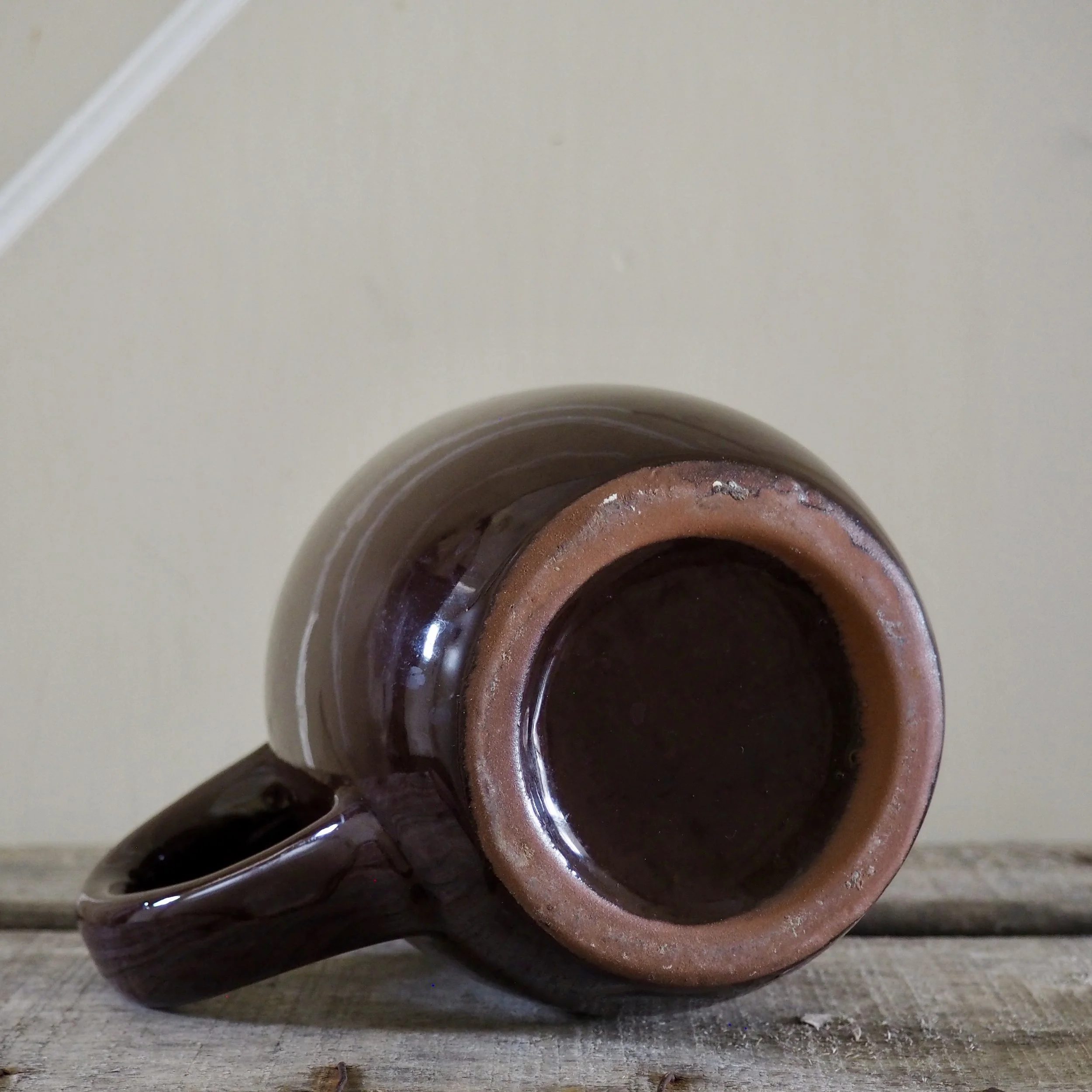 bottom of a brown jug