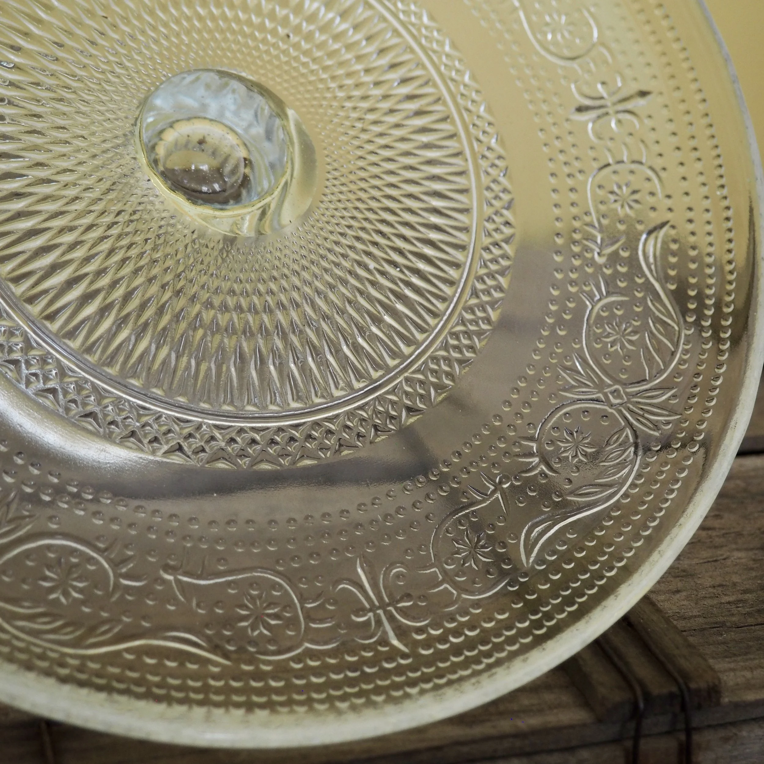 close up of pressed glass cake stand