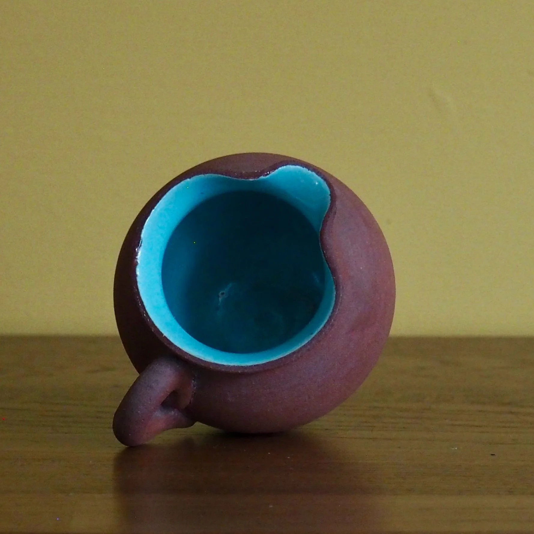 small terracotta jug side view