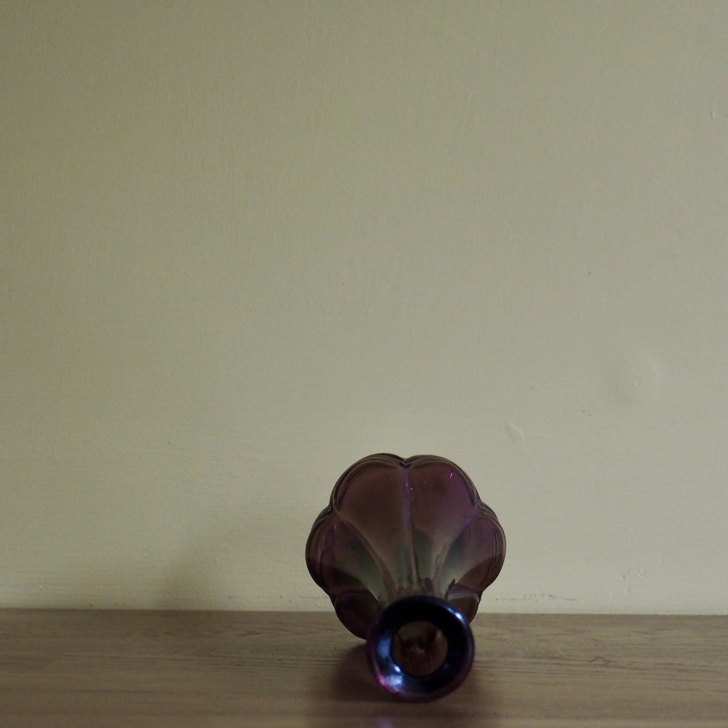 Tall vintage purple Avon stem vase Side view