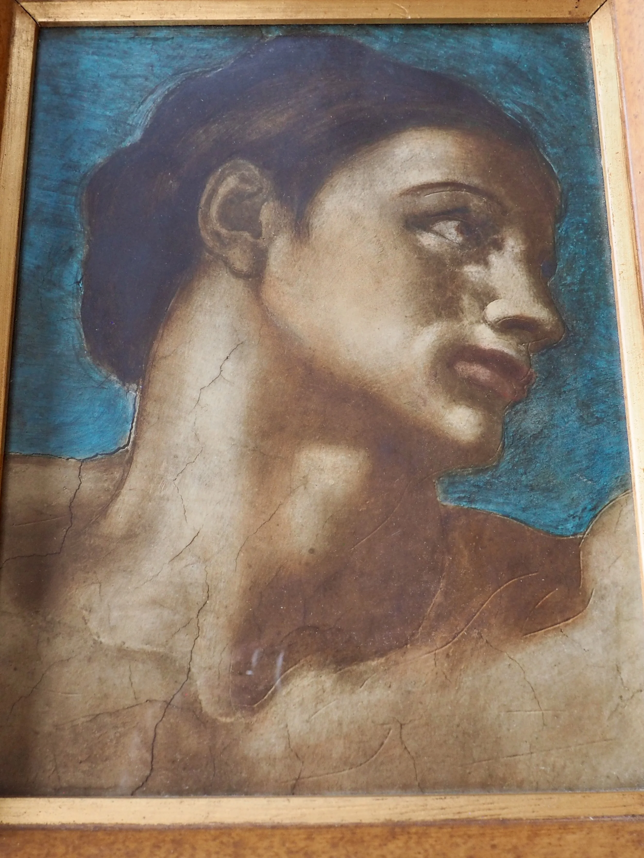 Print of a man’s head on a blue background