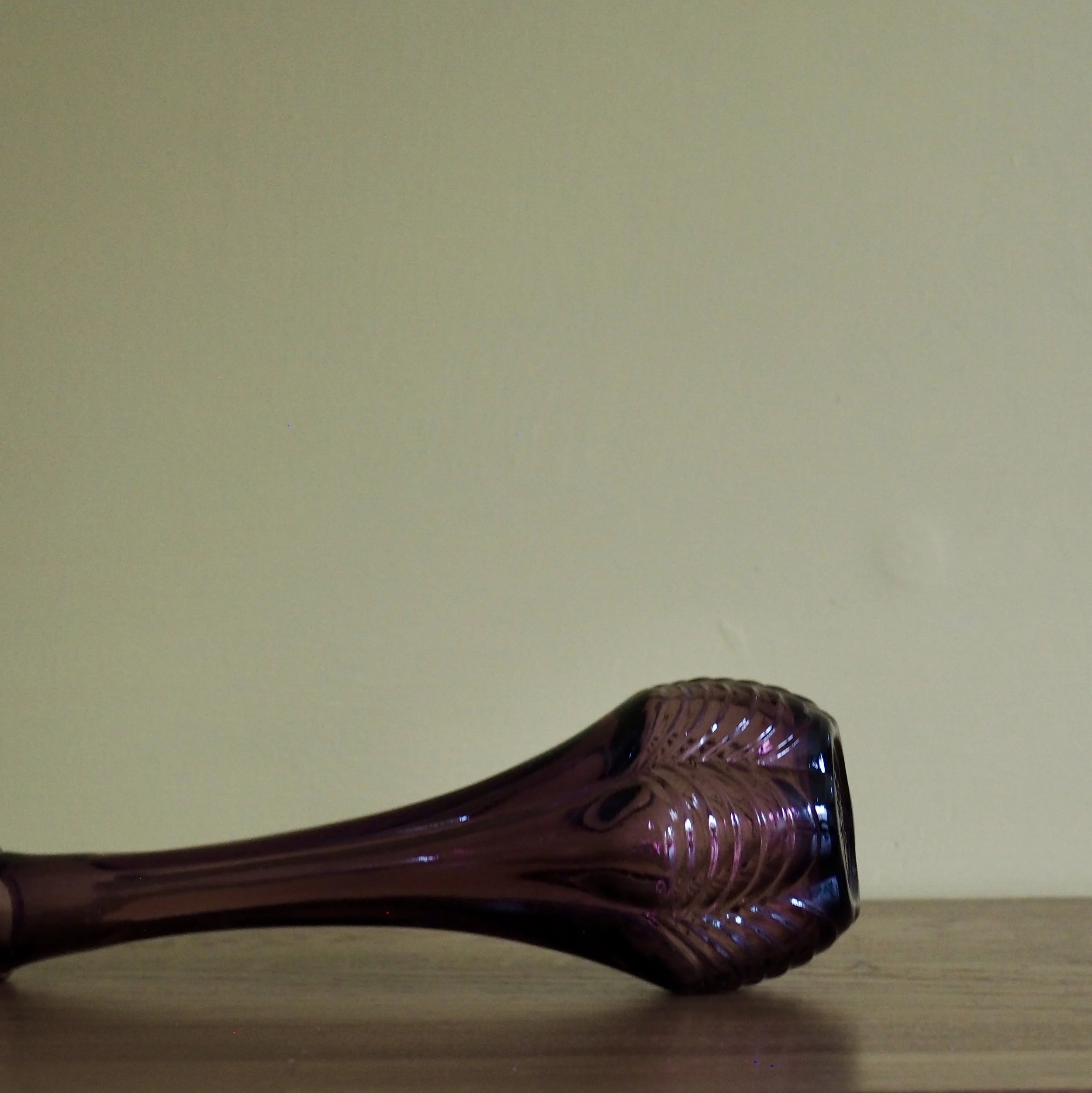 Tall vintage purple Avon stem vase