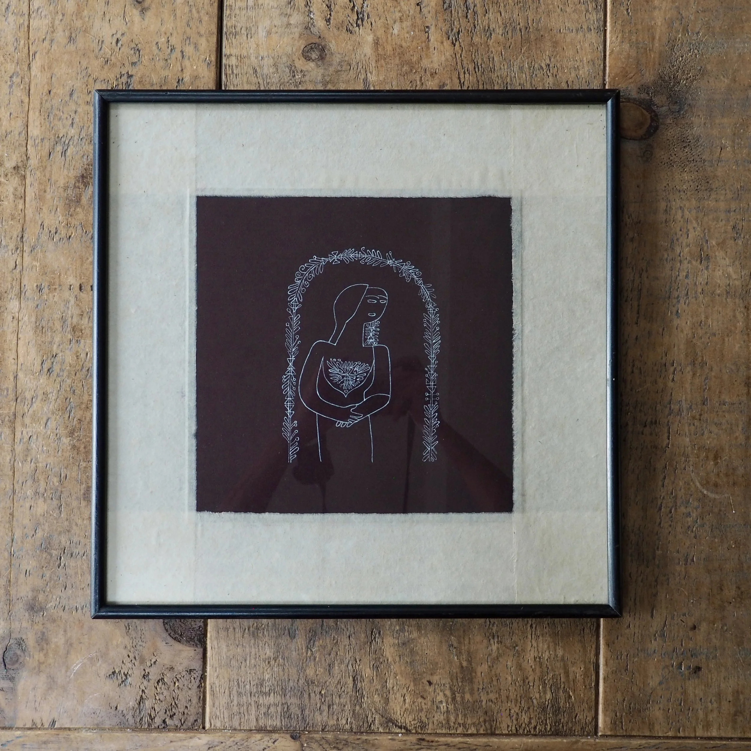 Simple framed pen sketch of a women
