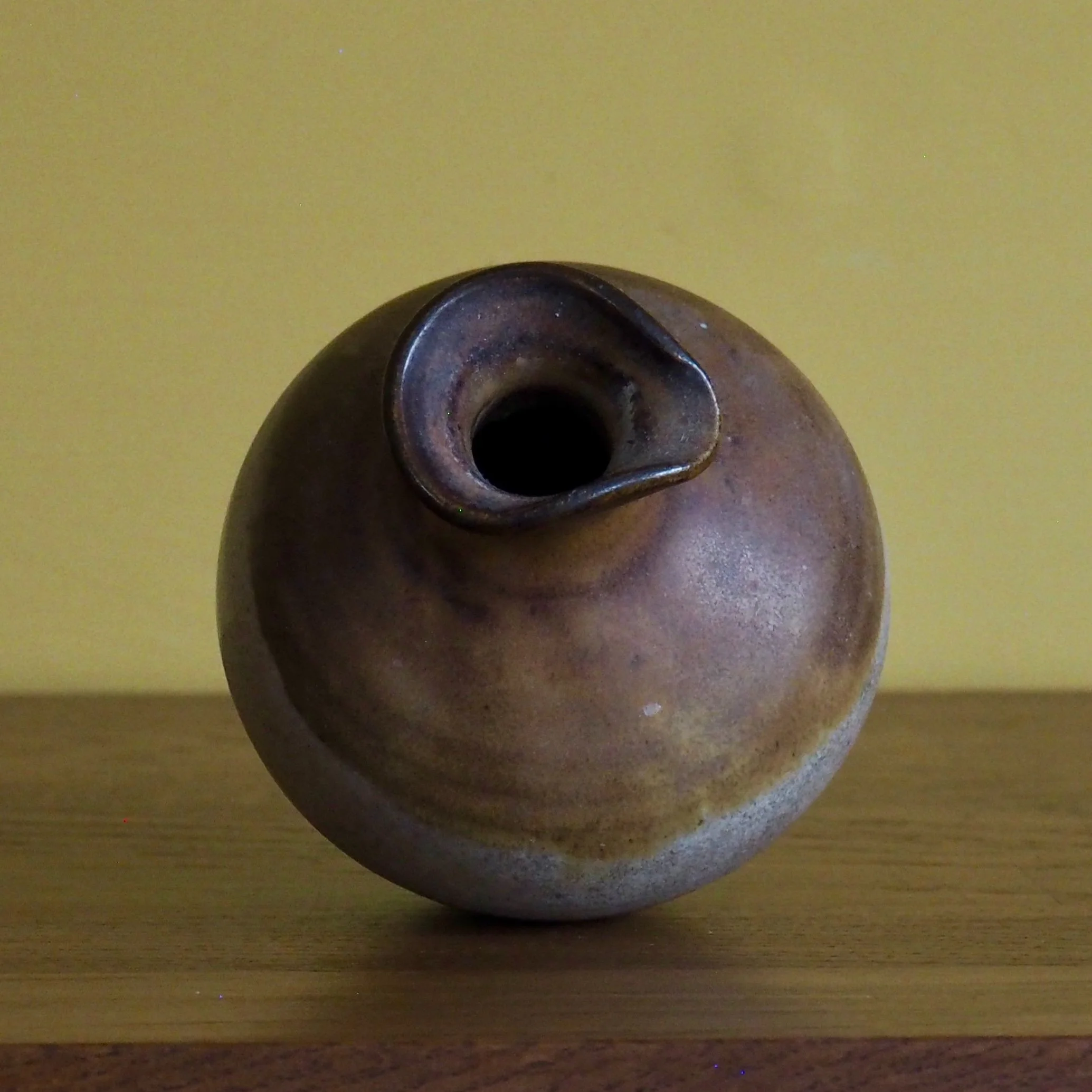 small rustic urn style vase side view