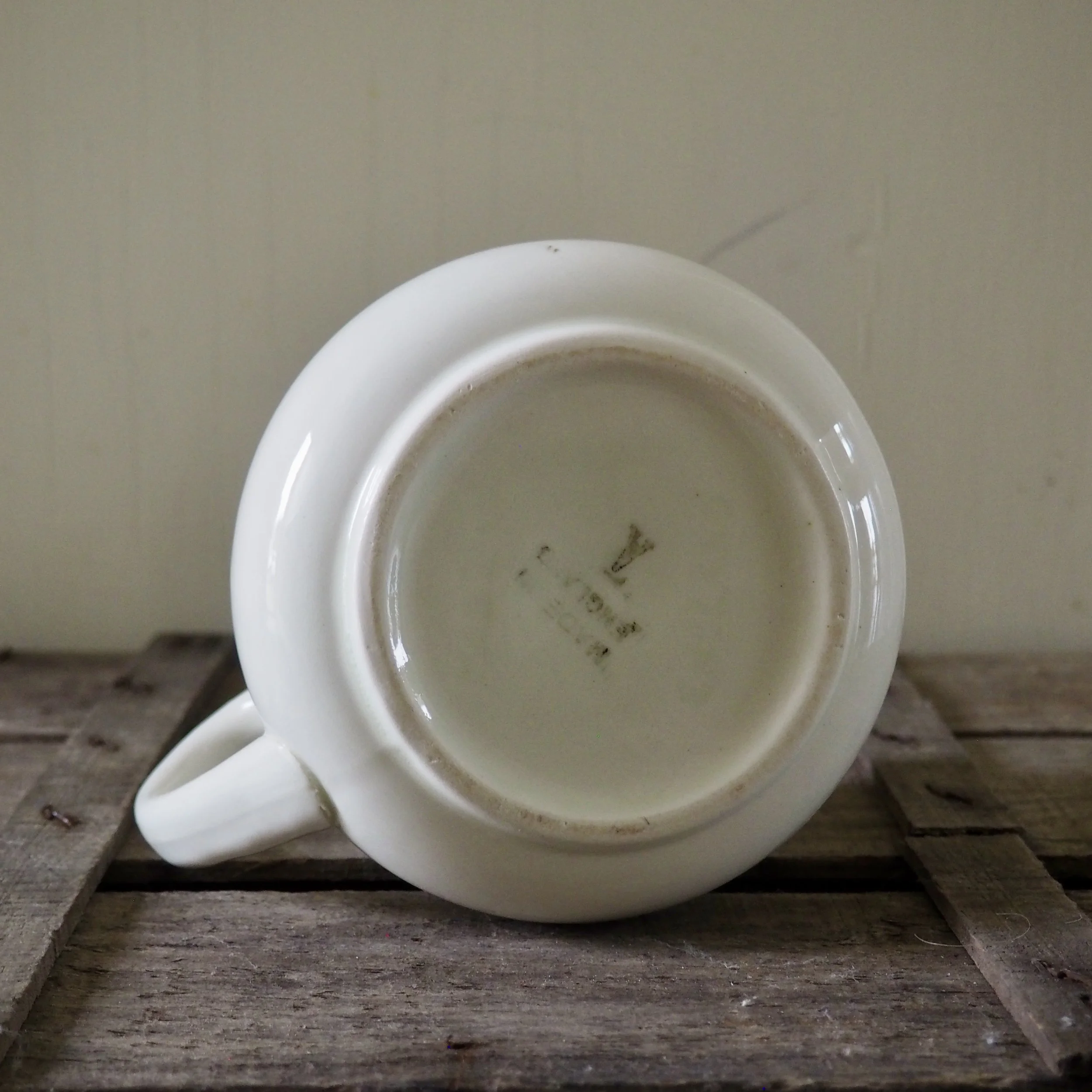 makers stamp on the bottom of a white jug