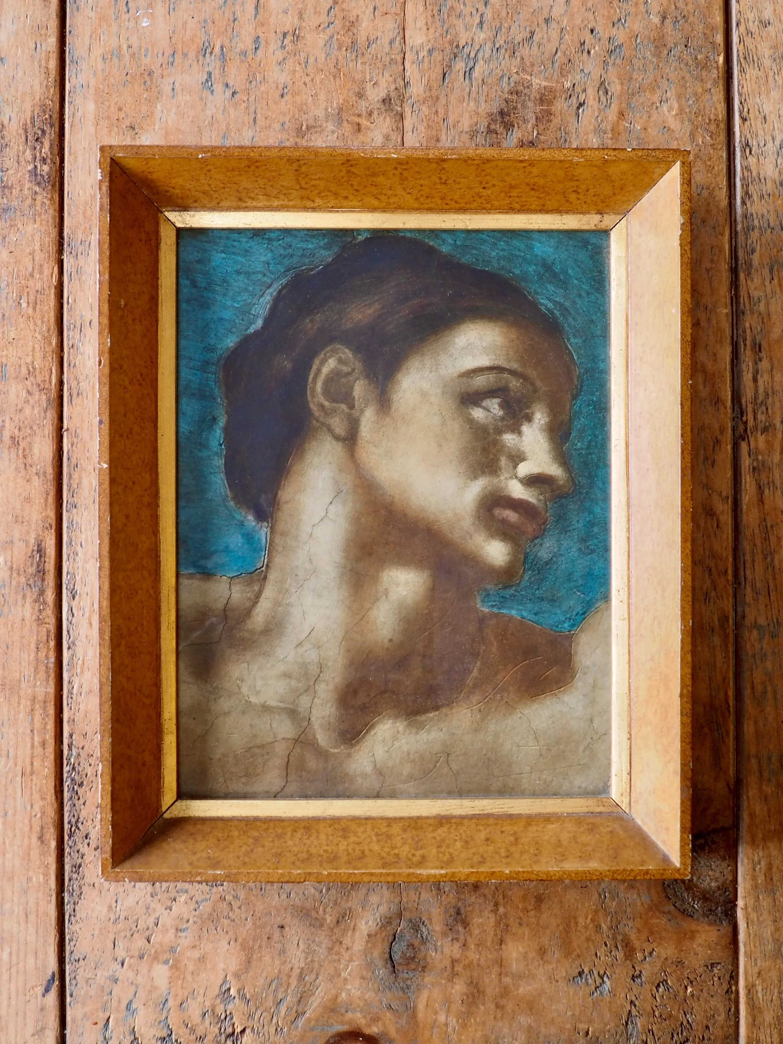 Print of a man’s head on a blue background