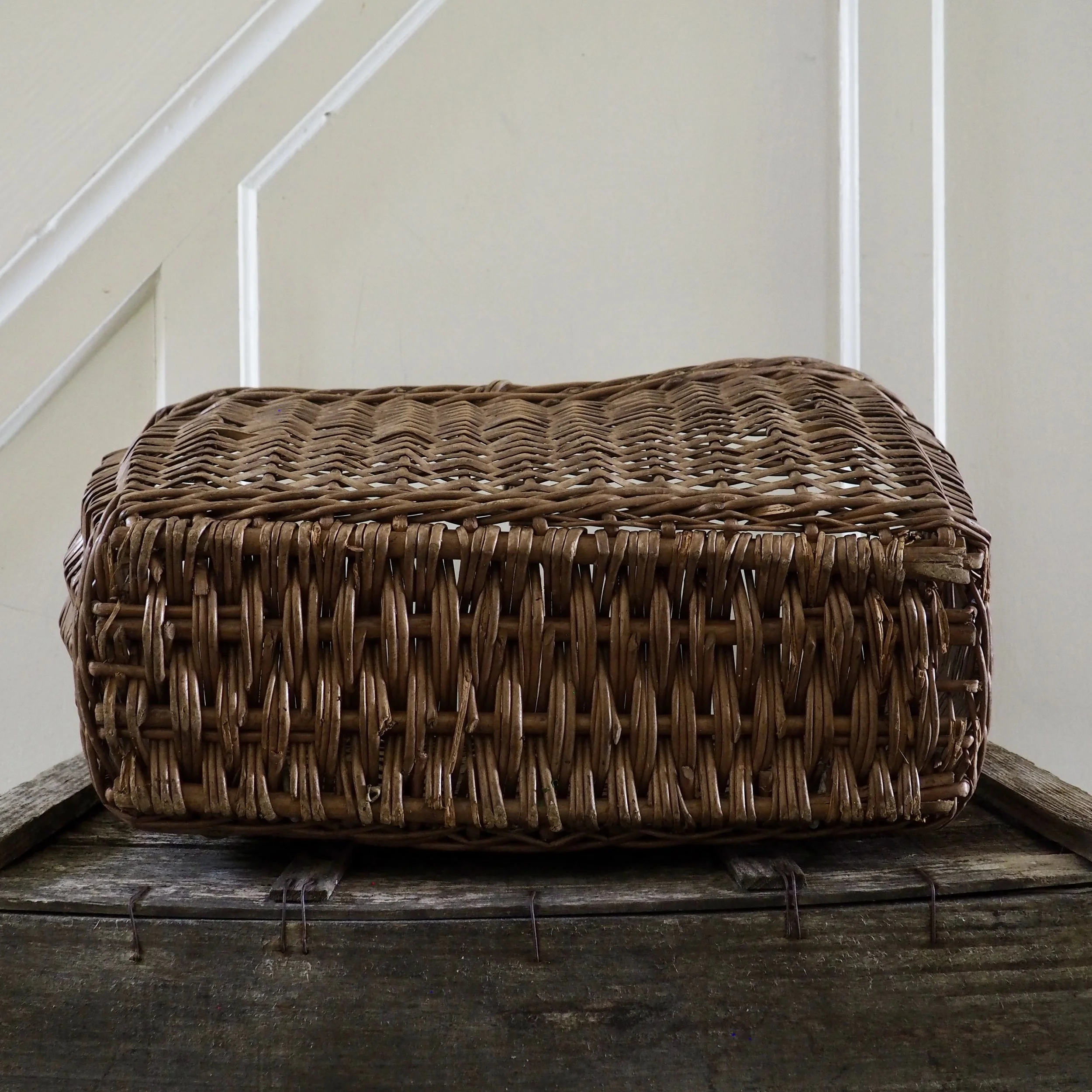 bottom of large vintage wicker shopping basket