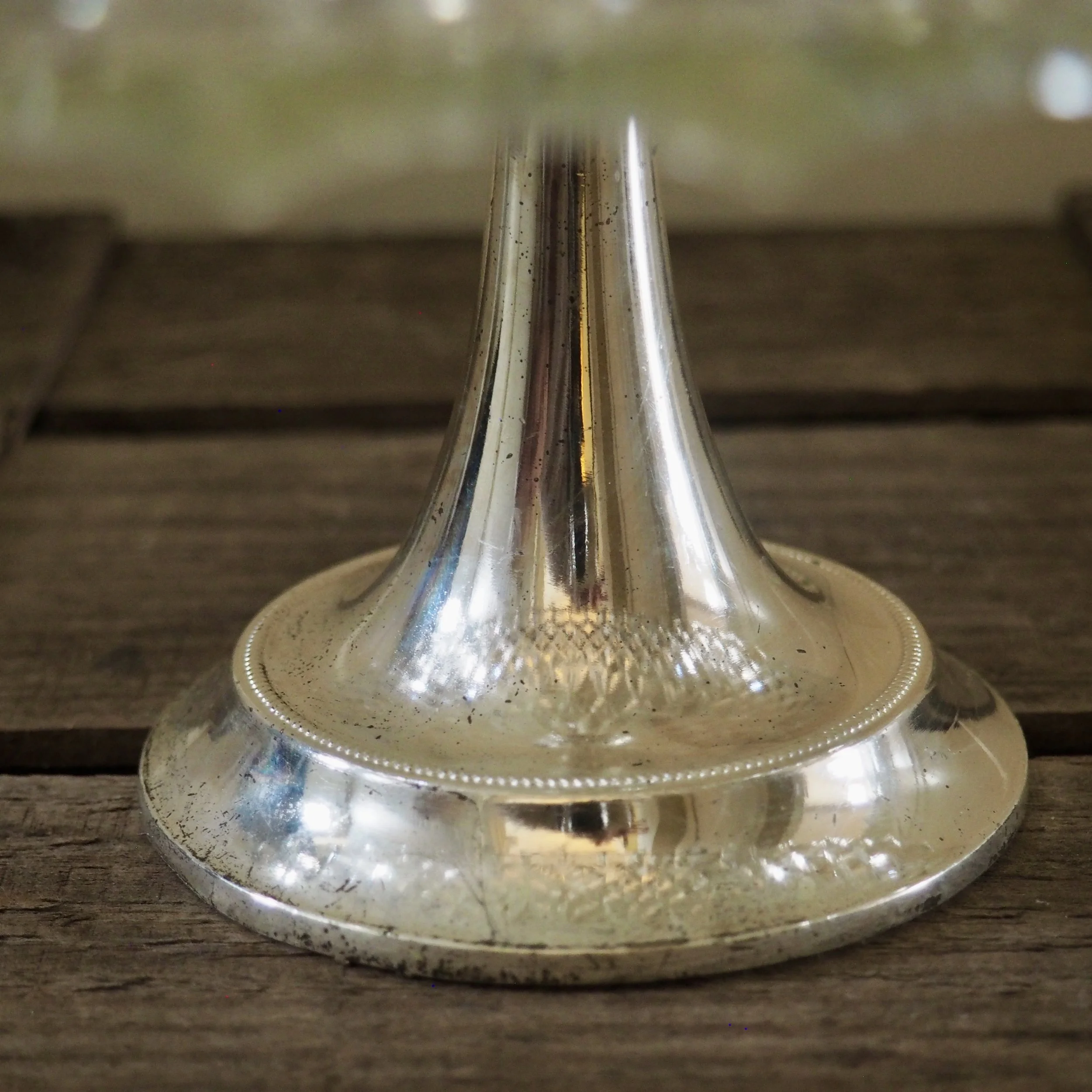 metal foot of pressed glass cake stand
